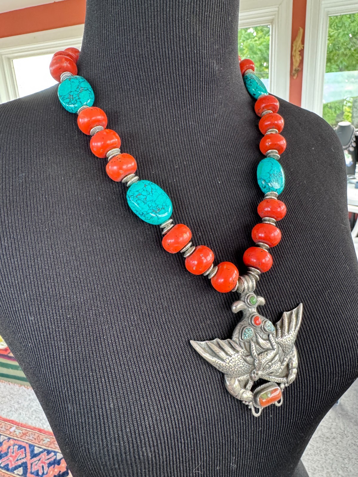 Silver Garuda pendant strung with natural coral and turquoise