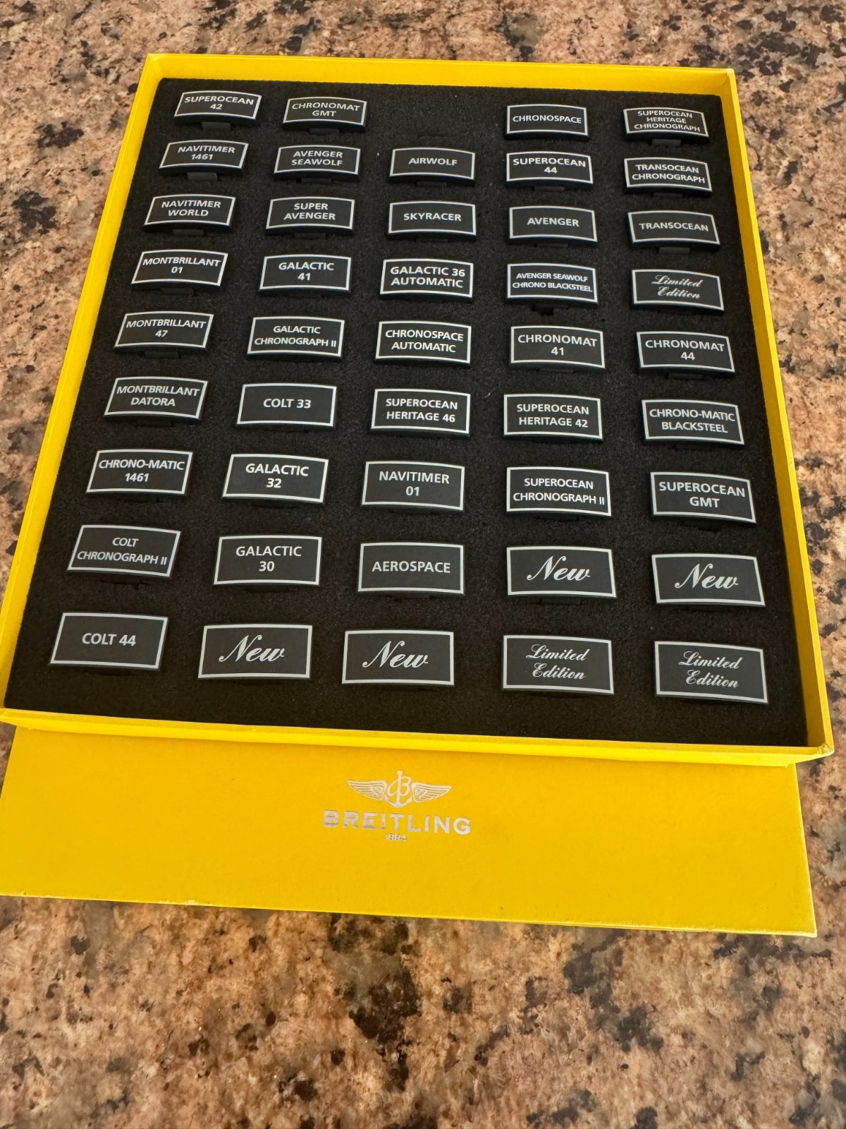 GENUINE BREITLING BOX WITH 44PCS OF VARIES PLASTIC PLAQUES FOR DISPLAY WATCHES
