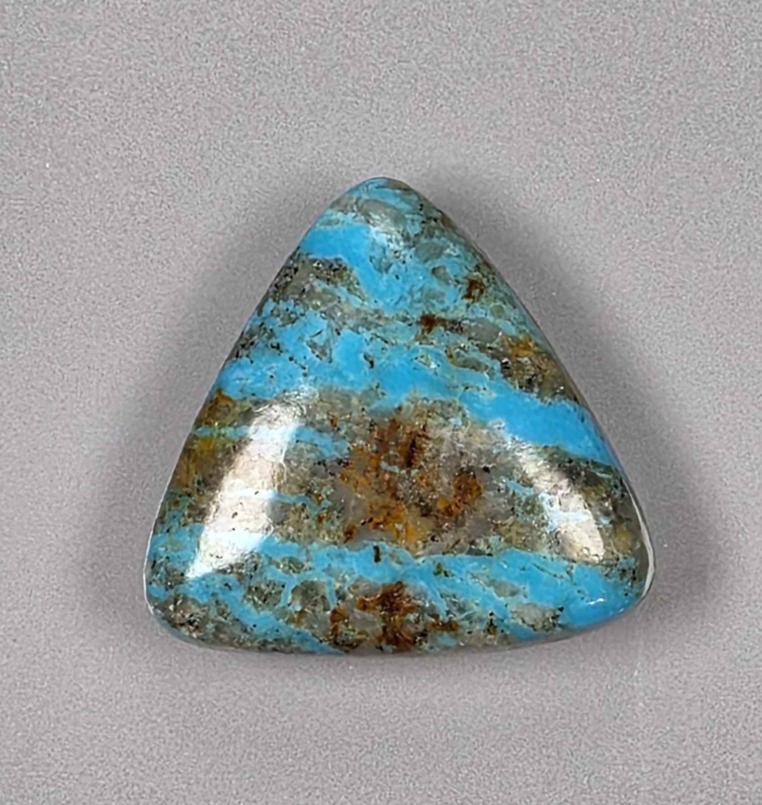 Kingman turquoise cabochon, boulder pattern, trillion cut, 30.49 carats, #B23