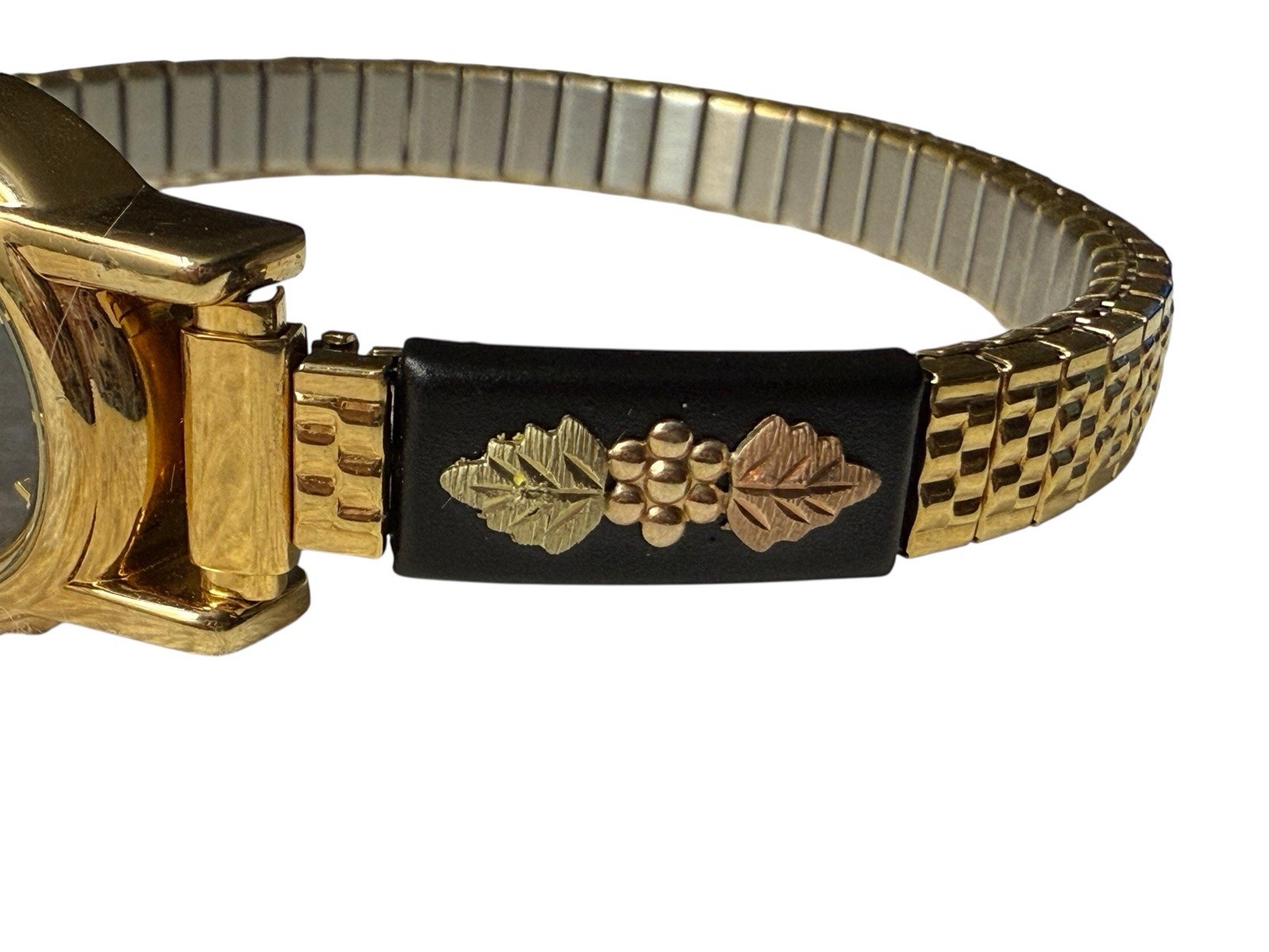 Ladies NOS Retro Vintage Black Hills Gold Stainless Steel Analog Wristwatch