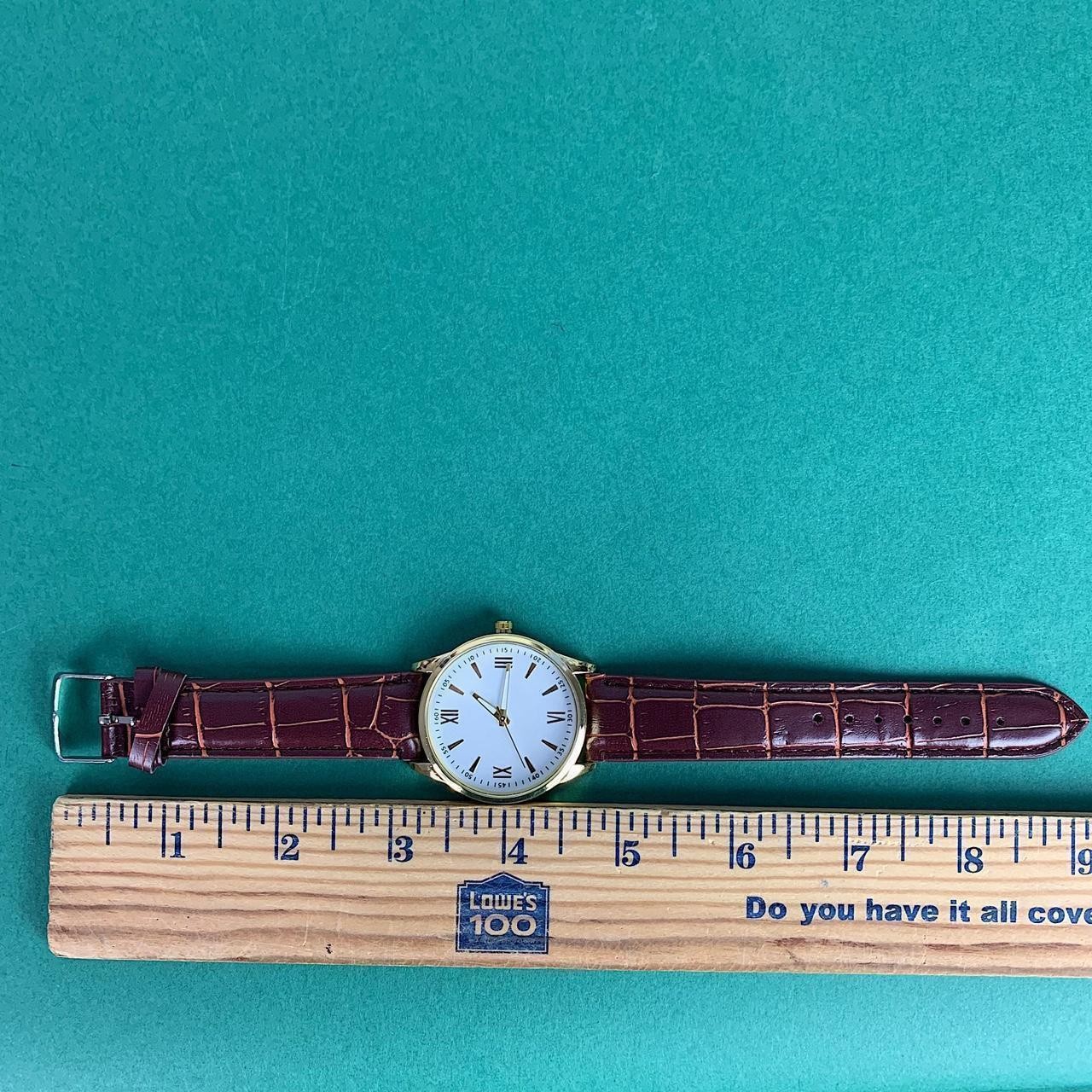 Minimalistic essential vintage style gold and leather style band watch. 9 inches