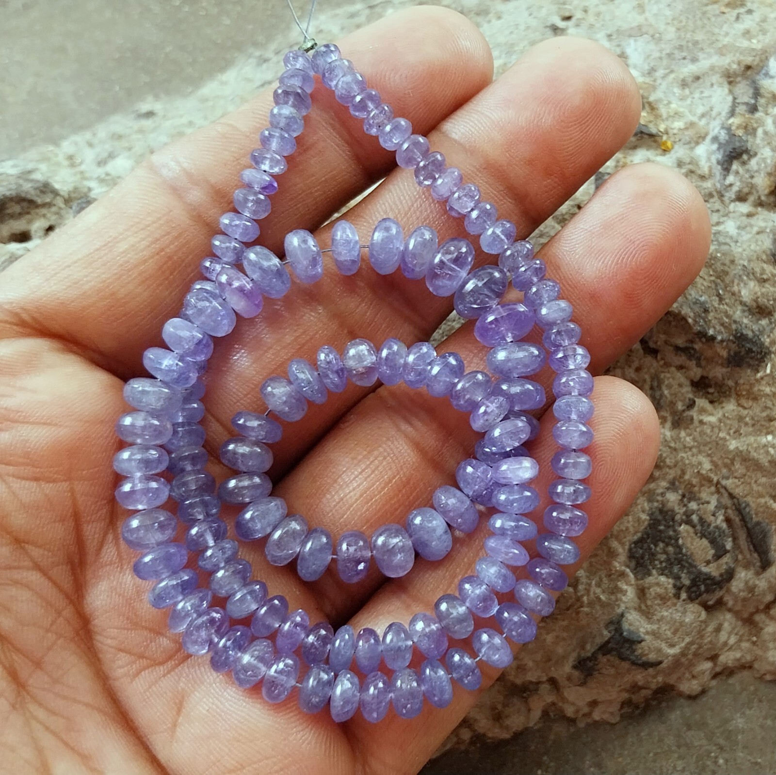141 Carat 4.5 to 8 MM Natural Light Blue Color Smooth Tanzanite 17 Inch Beads