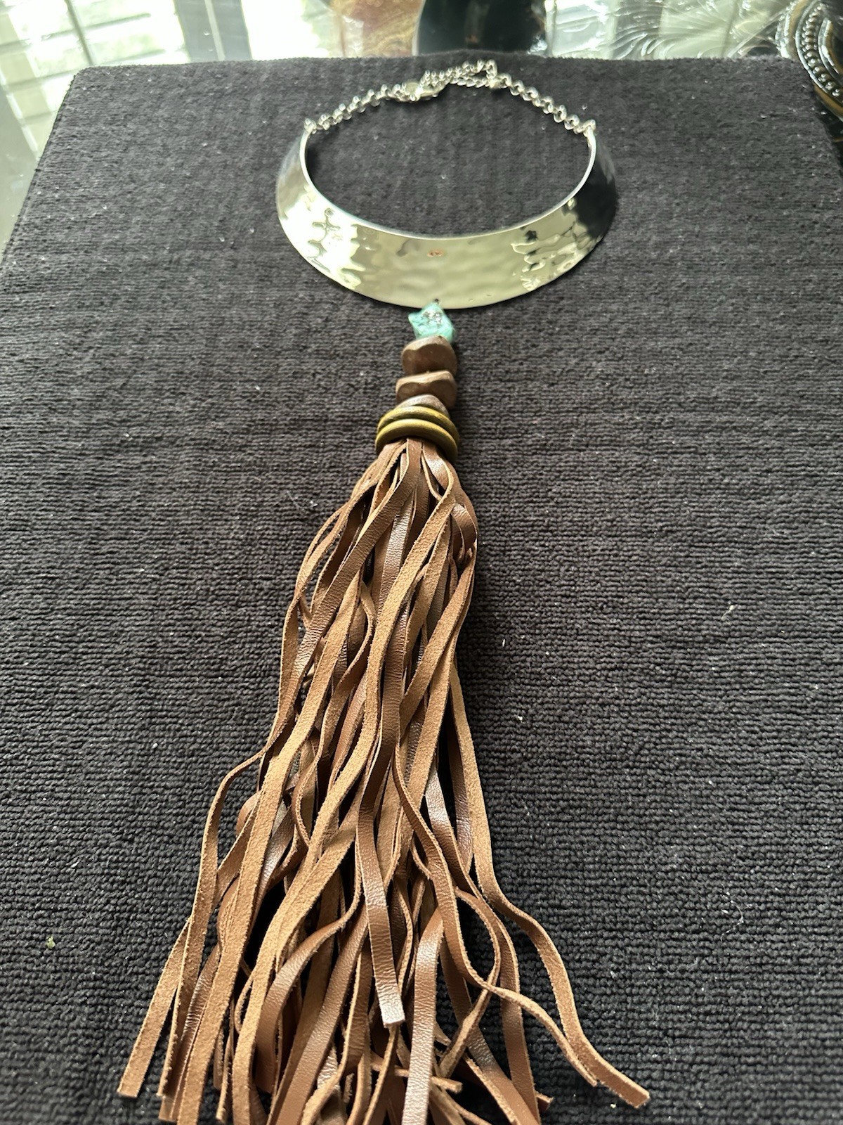 Chico’s boutique necklace; turquoise stone, metal with leather fringes;