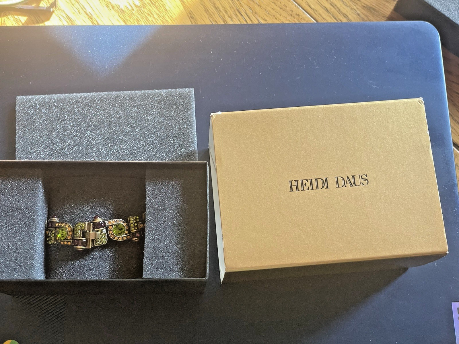 New Heidi Daus Bracelet in Original Packing. Olive Green, Red, Yellow Crystals.