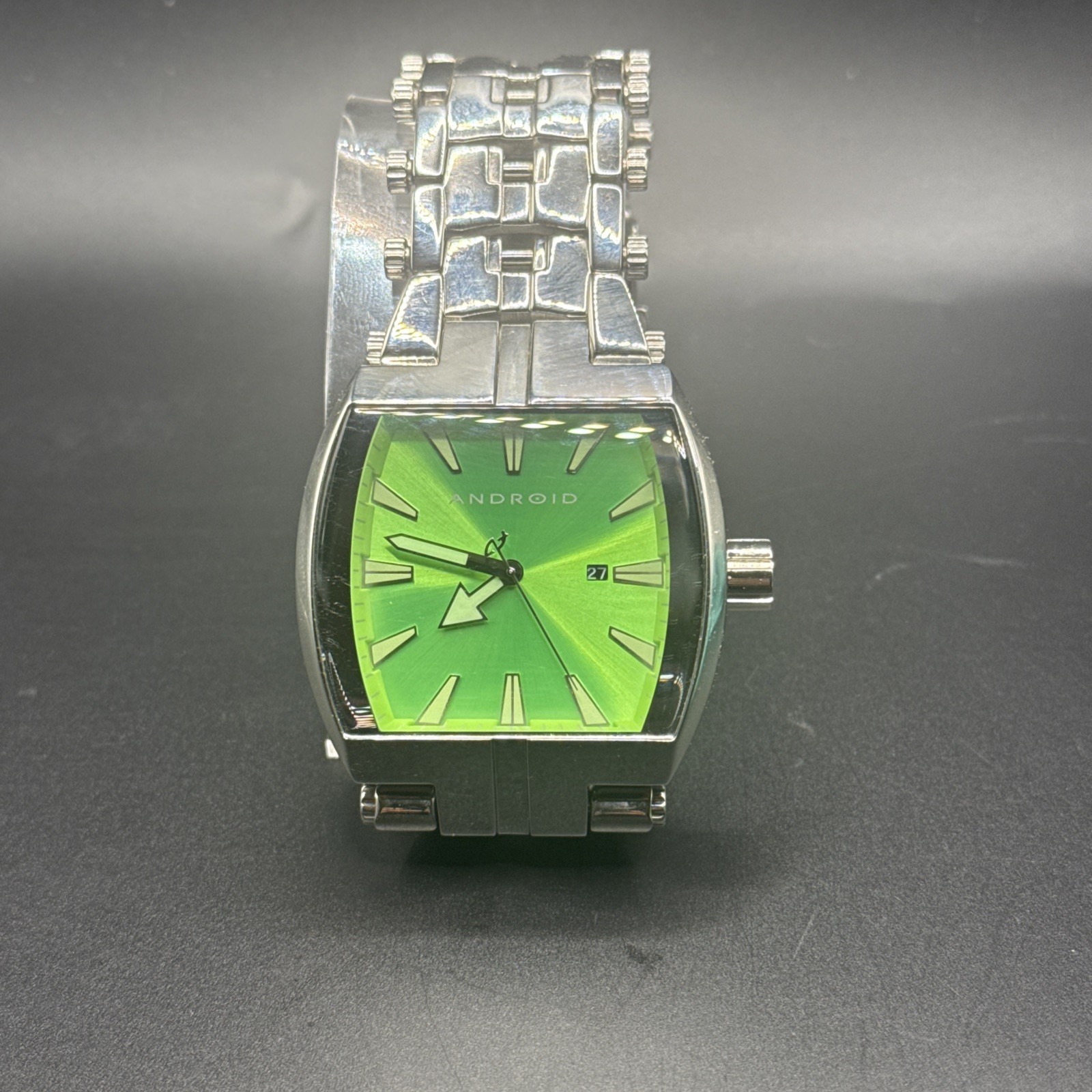 Android AD719 Watch vibrant green sunburst dial with an off-centered date window
