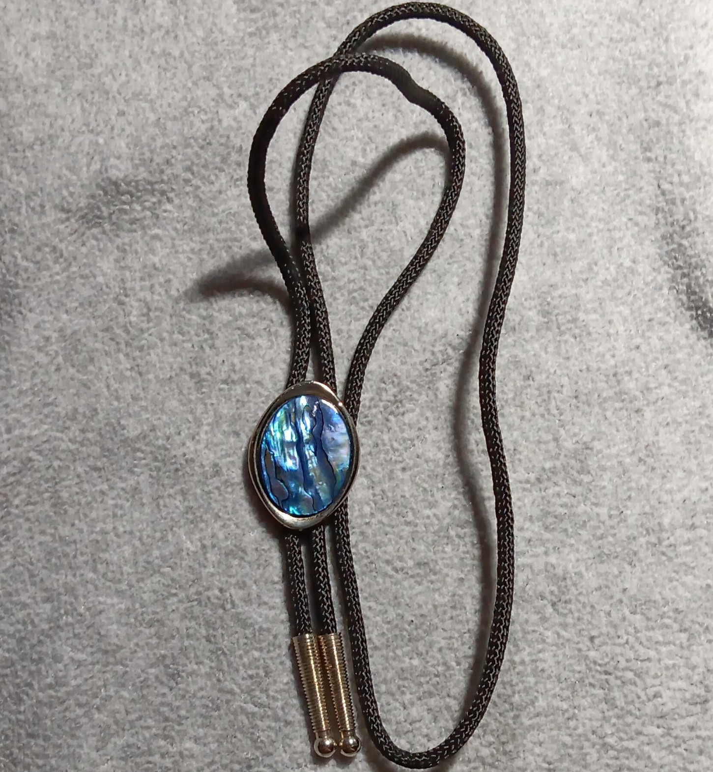 Men’s Western Bolo Tie Black Cord Oval Blue Mother of Pearl/Abalone Slide