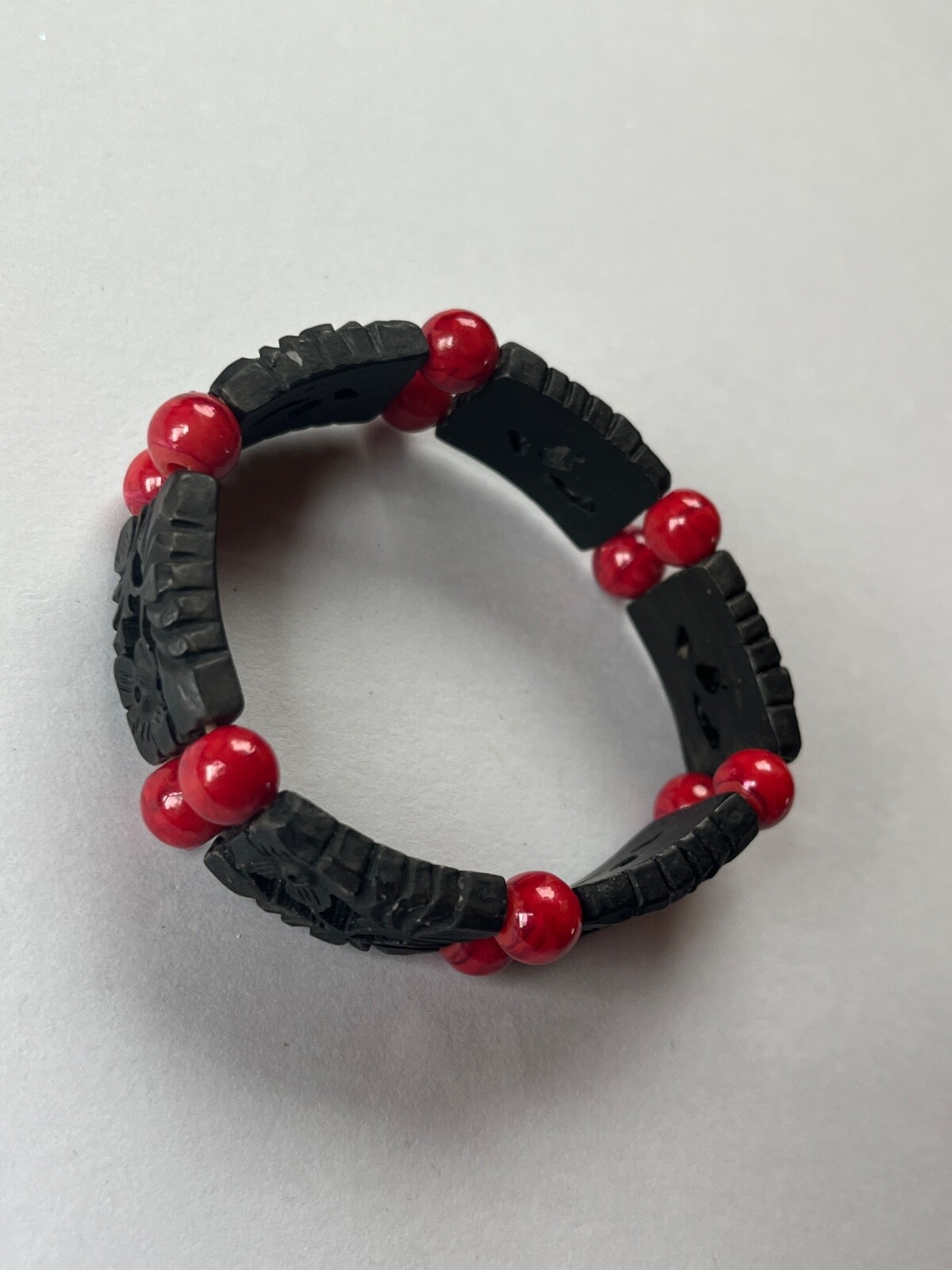 Alternating Carved Black Floral Rectangle & Red Round Plastic Beads Stretch Brac