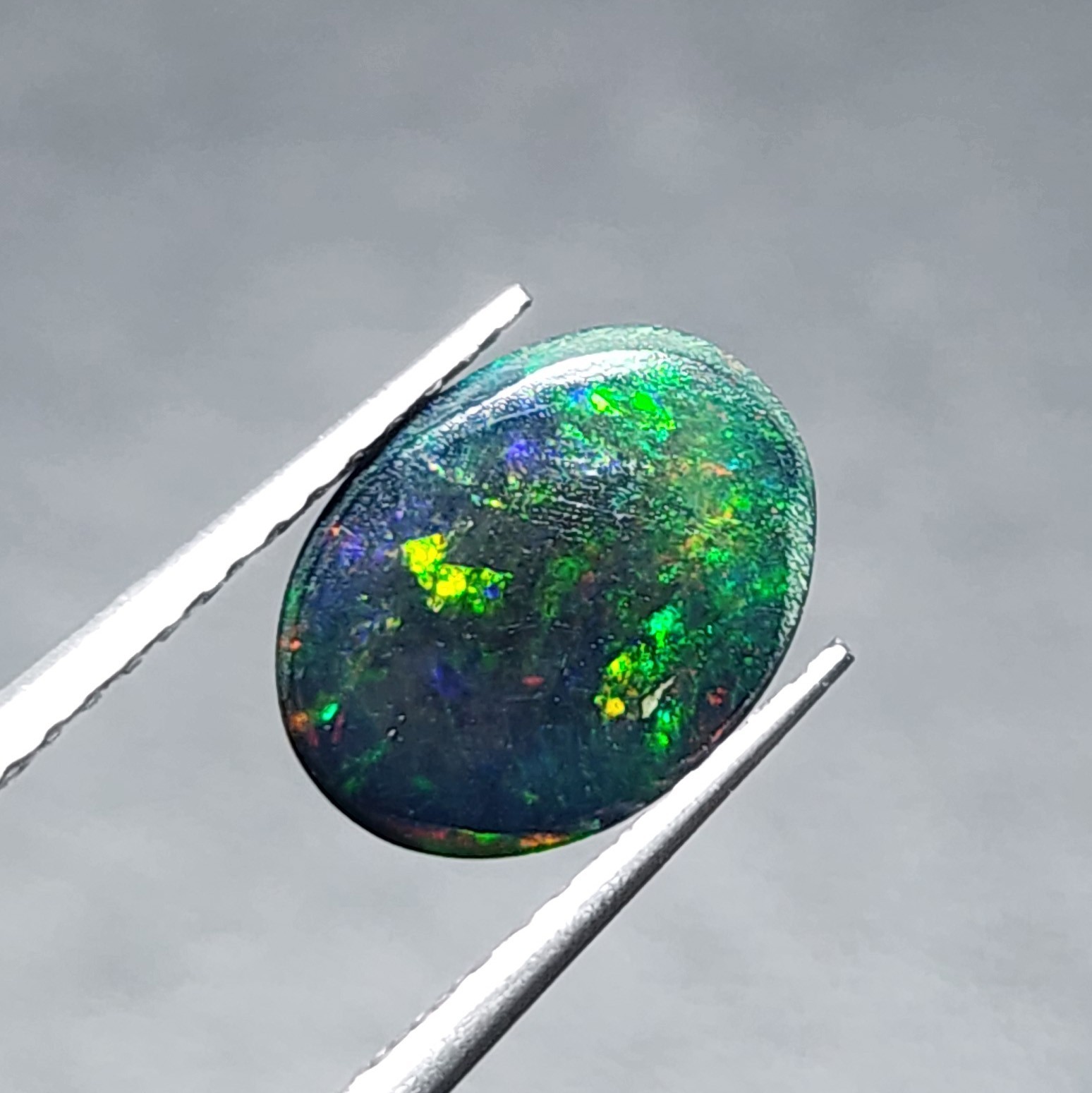 Natural Welo Black Opal Ethiopia Oval Cabochon Vivid Green Fire Gemstone 1.20Ct