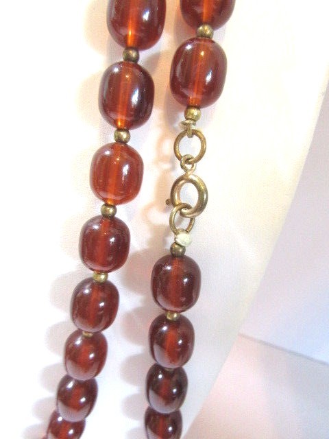 LUCITE SEMI TRANSPARENT TEA BROWN COLOR NECKLACE LONG GOLD TONE SPACERS VINTAGE
