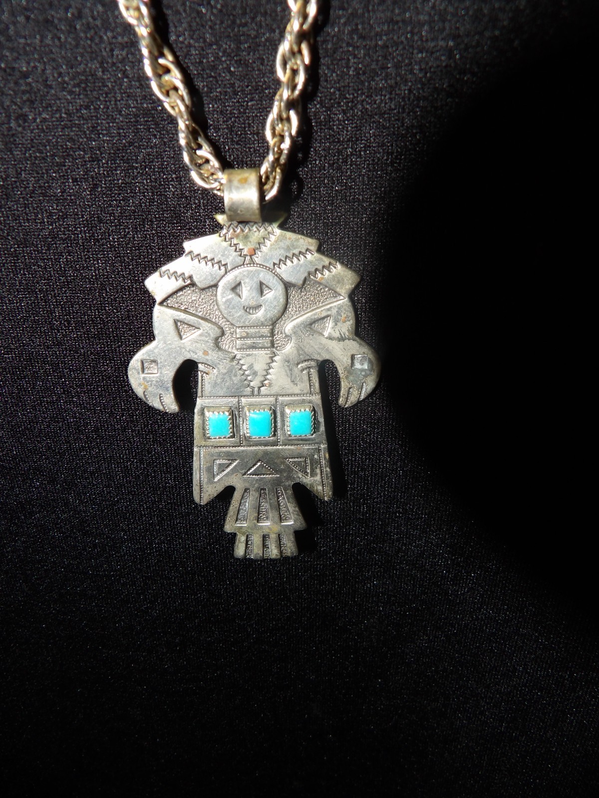 Navajo Kachina Totem Turquoise BRanded Nickle Silver Bell w/28″ Braided Chain.