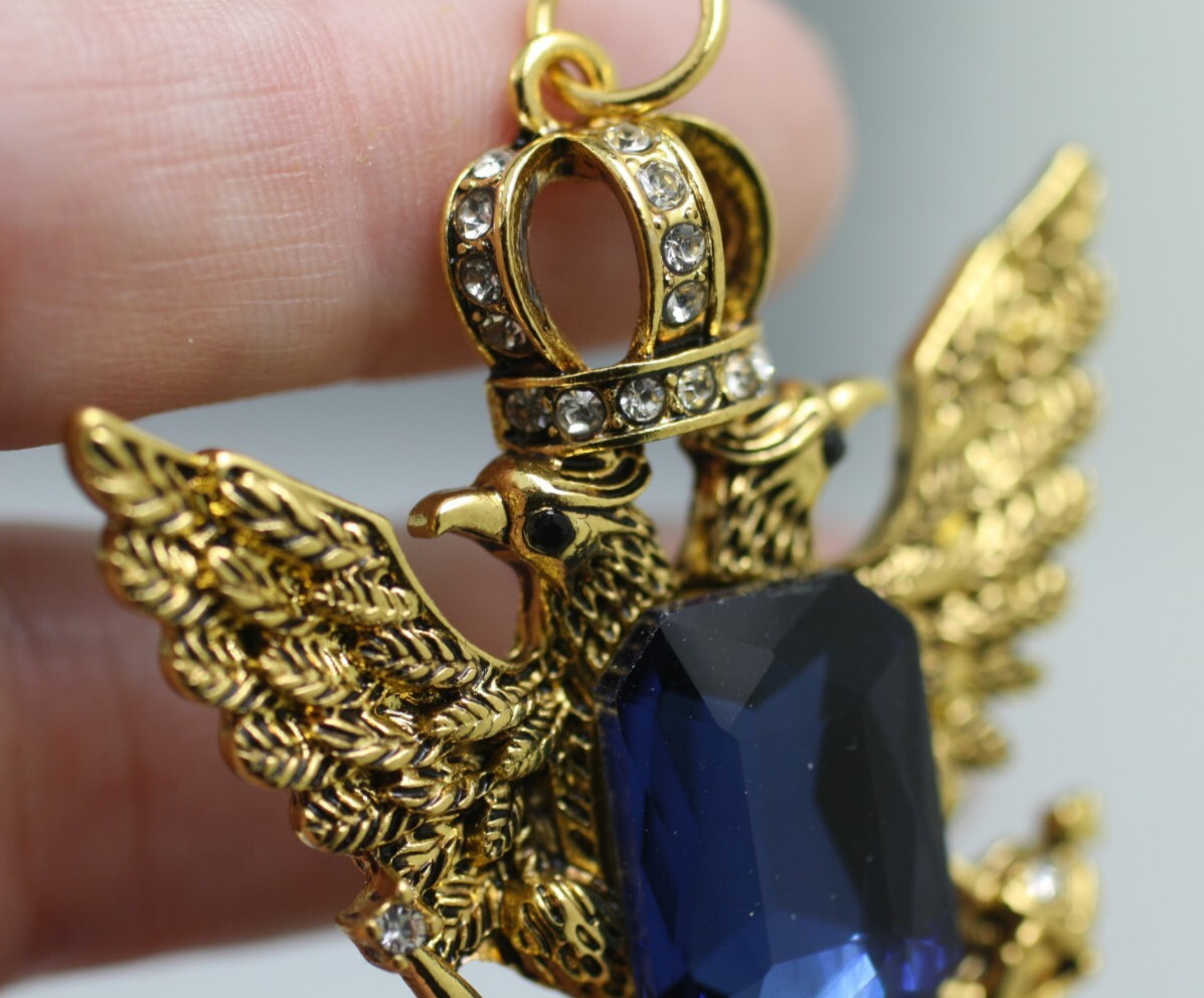 Gold tone double eagle crown blue emerald cut stone pendant regal style