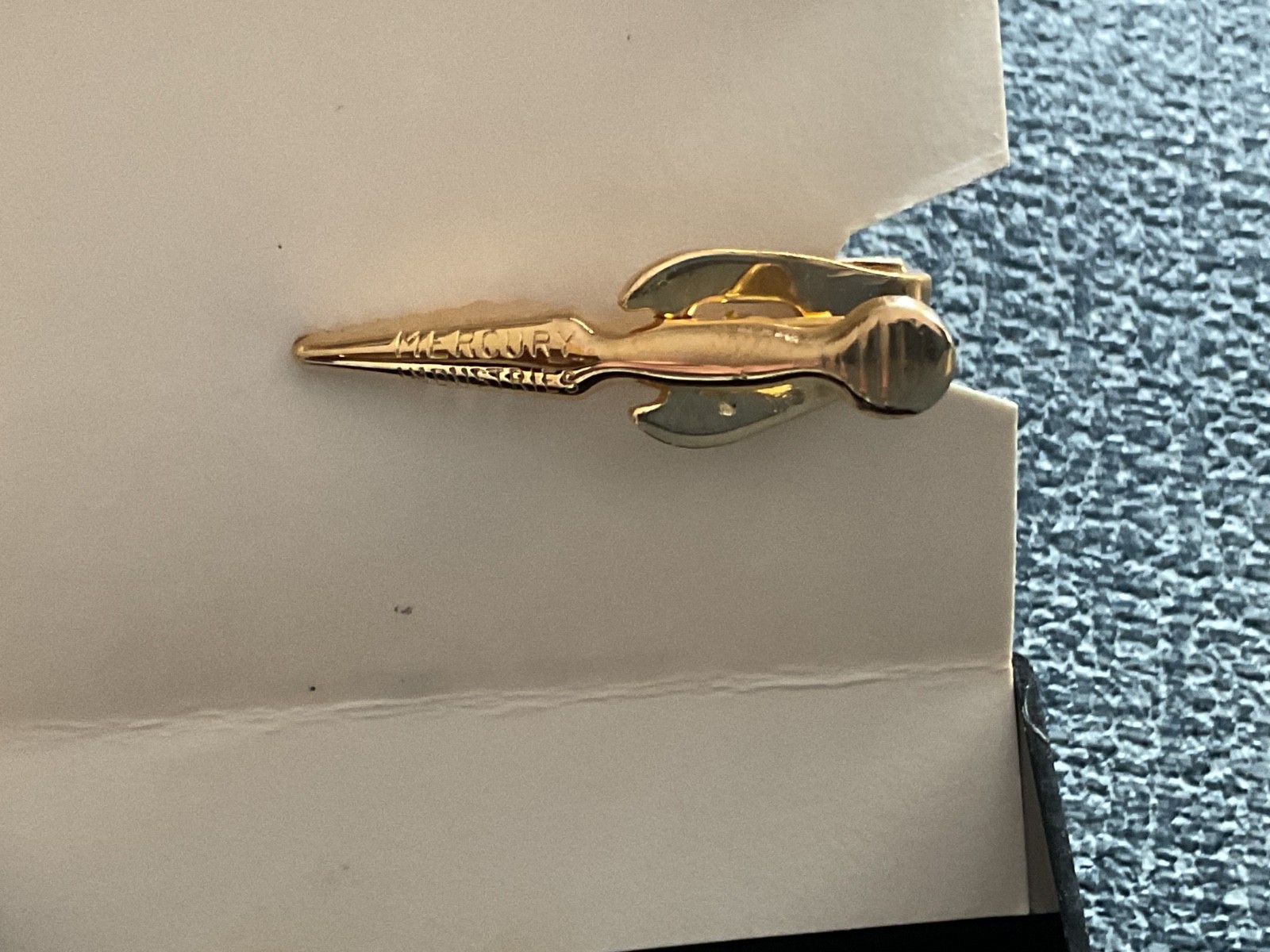 vintage Kinney Mercury tie clip with an Sherlock detective and magnifying glass