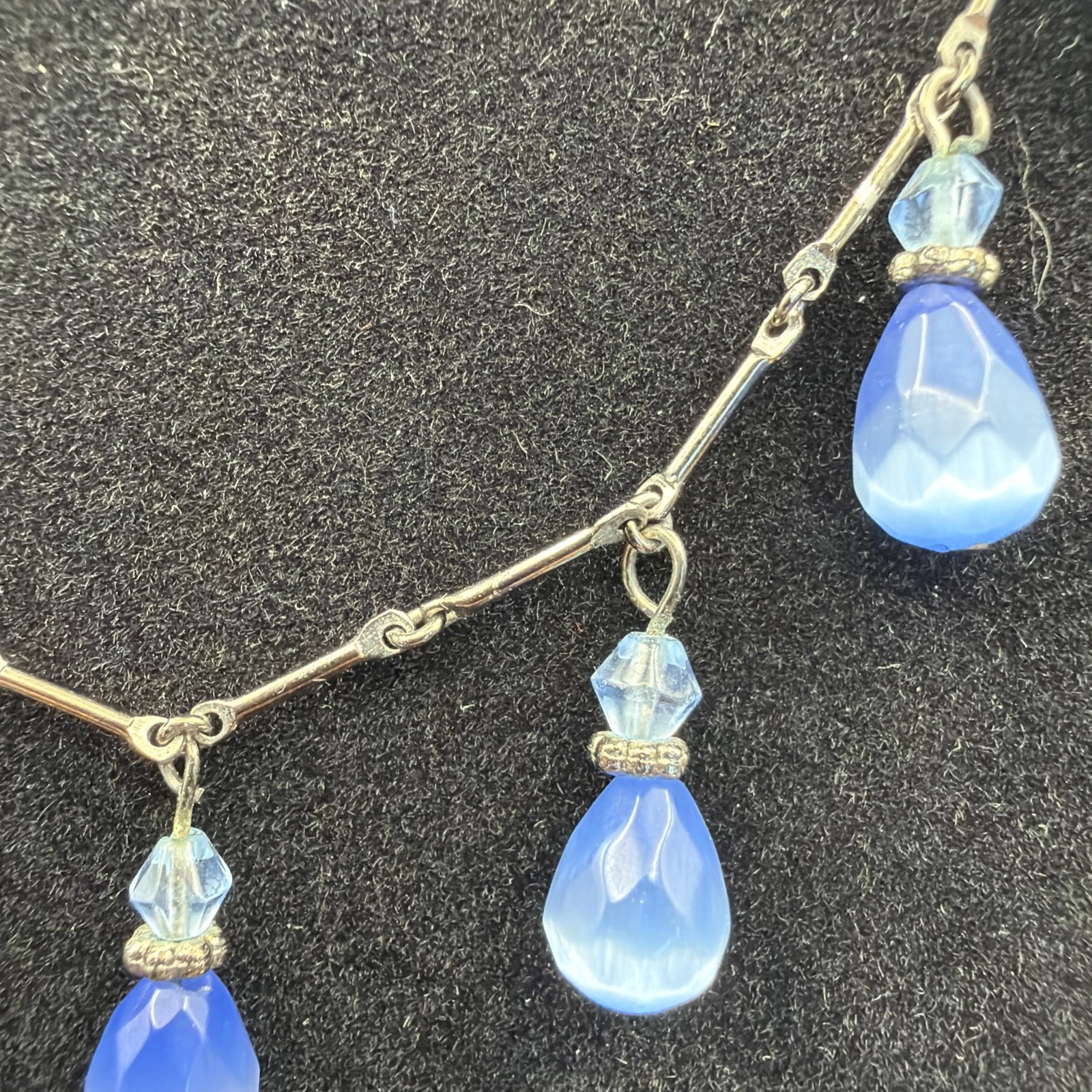 695. Oxidized Gun Metal Chain Pale Blue Satin Glass Teardrop Dangles