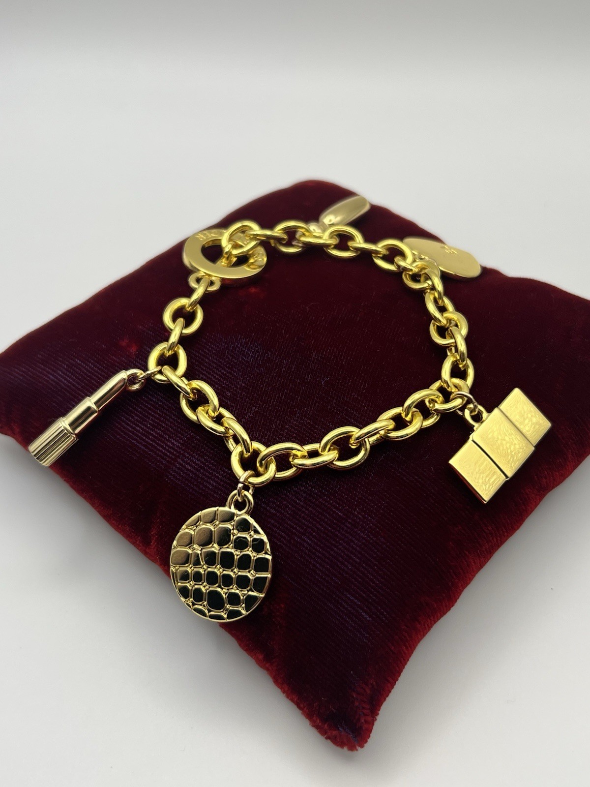 Vintage ESTEE LAUDER Runway Gold Tone Charm Bracelet Couture 7.5 ”