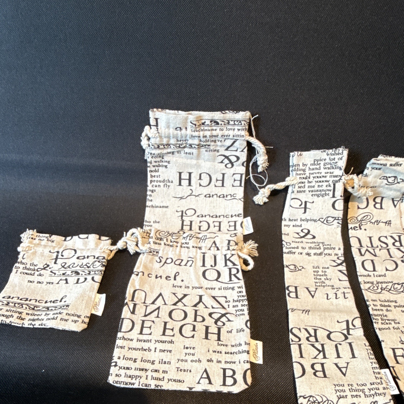 Set of 4 Fabric Drawstring Jewelry Pouches Letter Print Beige/Black Rectangle