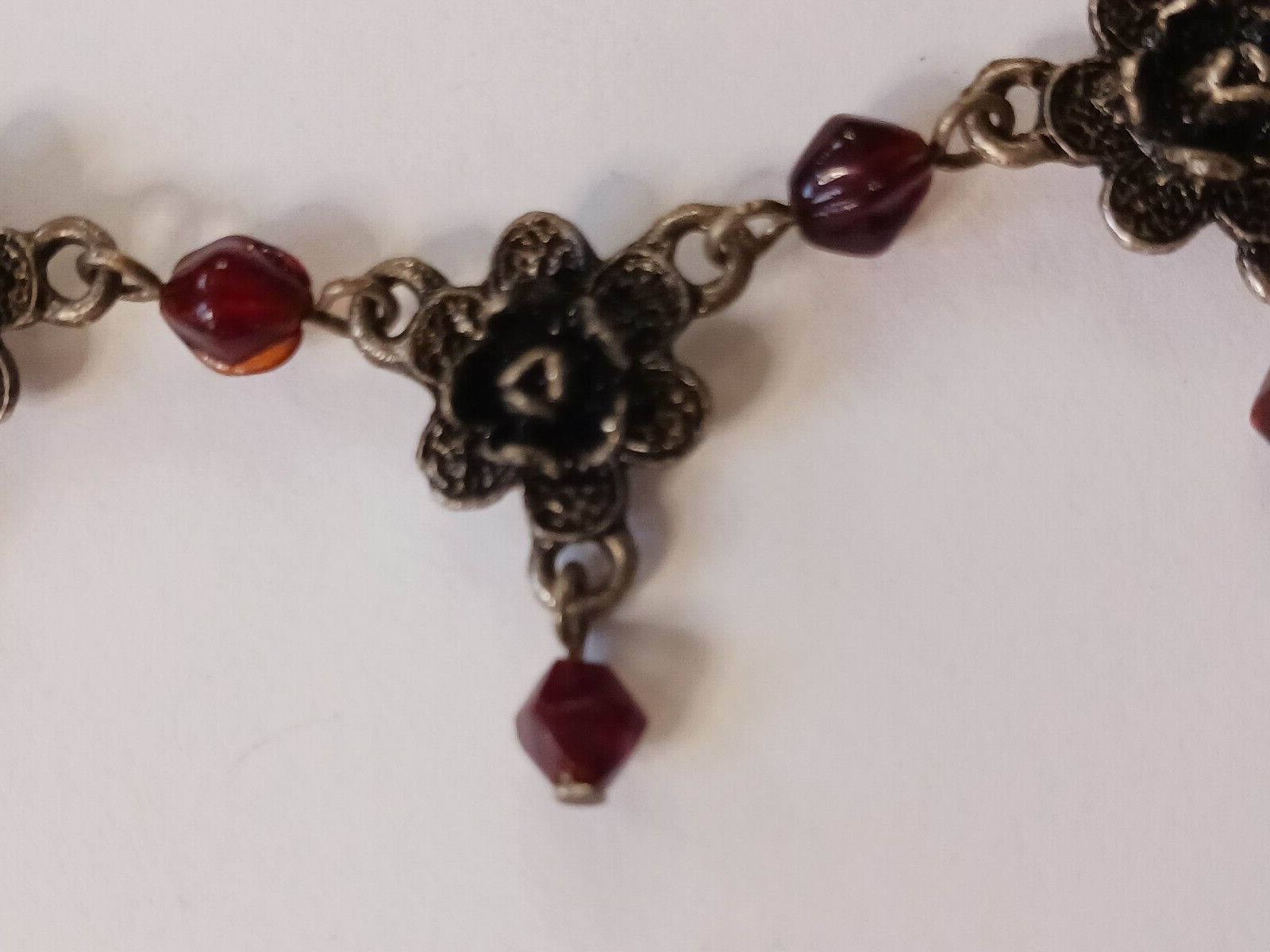 Beautiful silver tone necklace with flowers and red stones. hook clasp. Vintage