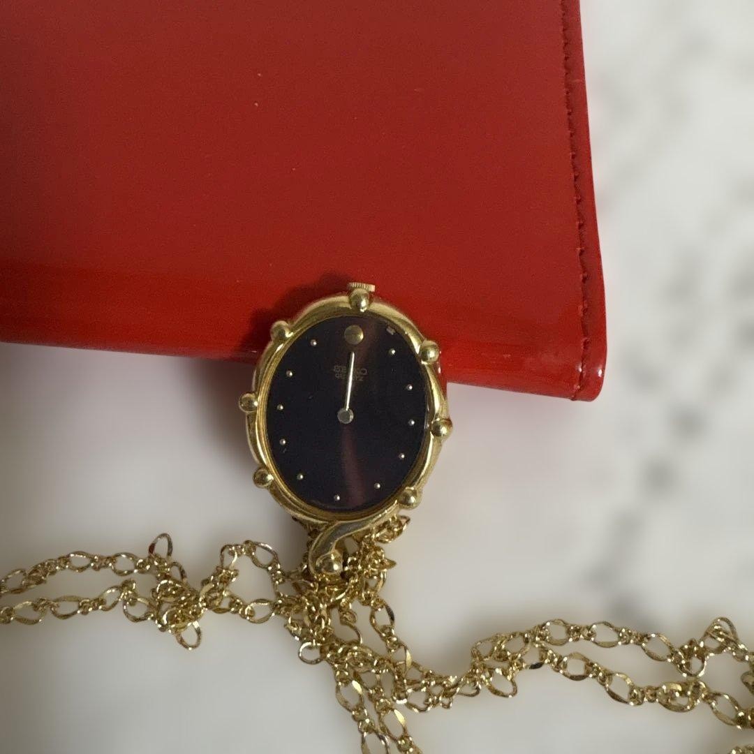 Seiko pendant watch, gold chain, working, burgundy dial.