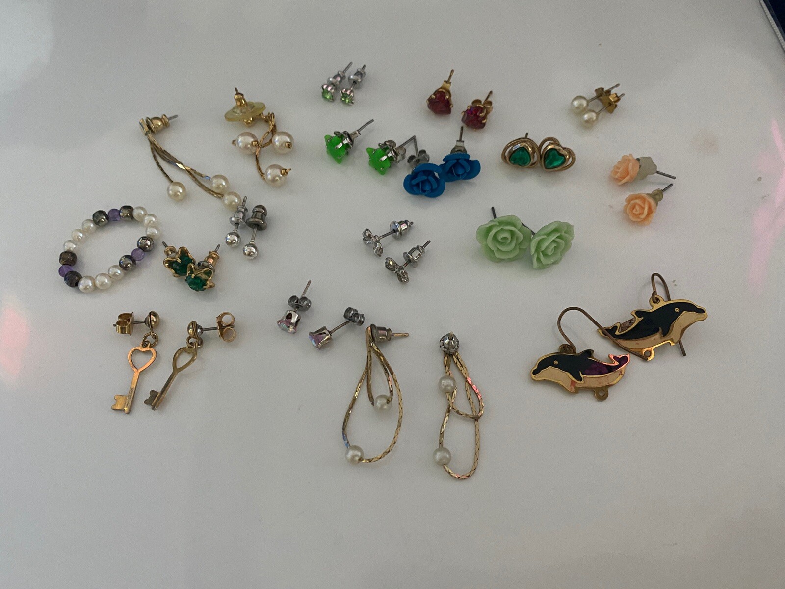 A Lot of 18 Pair Of Costume Earrings And One Stretch Ring.