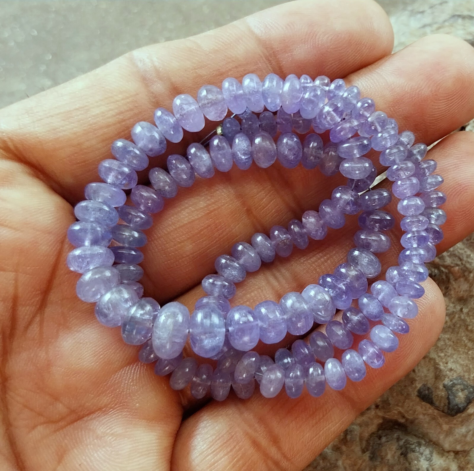 141 Carat 4.5 to 8 MM Natural Light Blue Color Smooth Tanzanite 17 Inch Beads