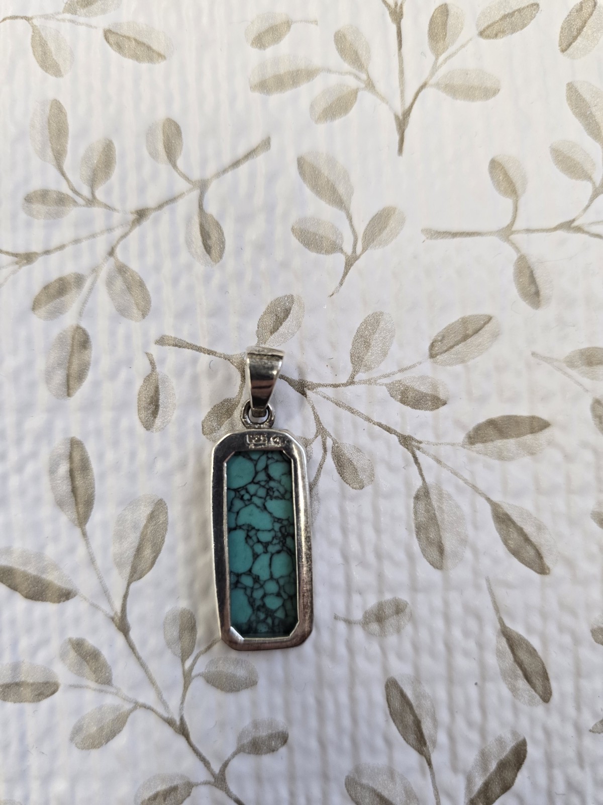 Sterling silver (925) turquoise pendant featuring a rectangular cabochon