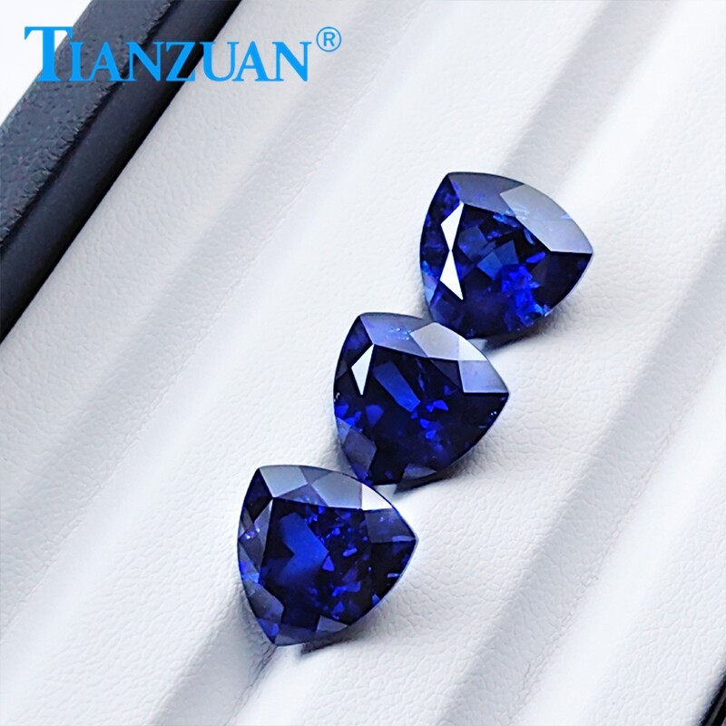 Lab Created Trillion shape Royal Blue Sapphire loose gemstone with Inclusions