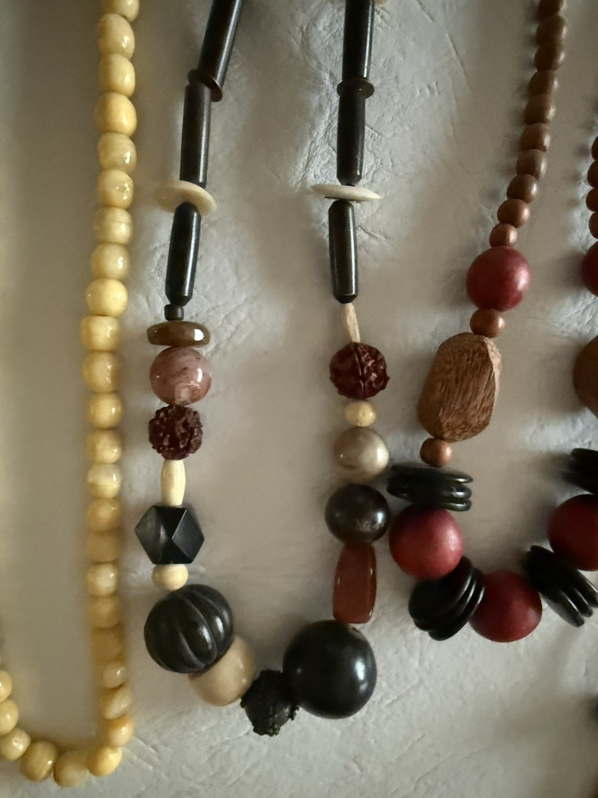 Lot of 10 necklaces, mostly wood beads, some Lucite, ethnic look earth tones
