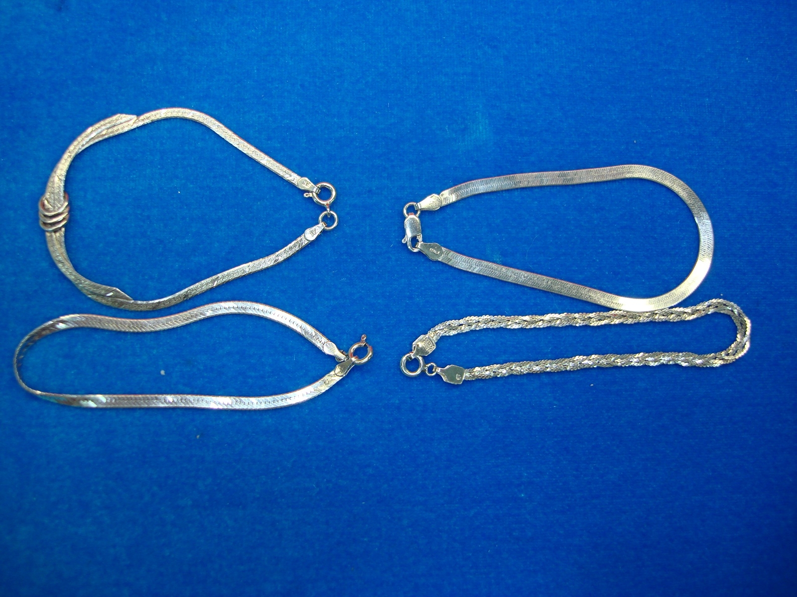 4 PRETTY STERLING SILVER BRACELETS – ALL DIFF. – NICE TOO