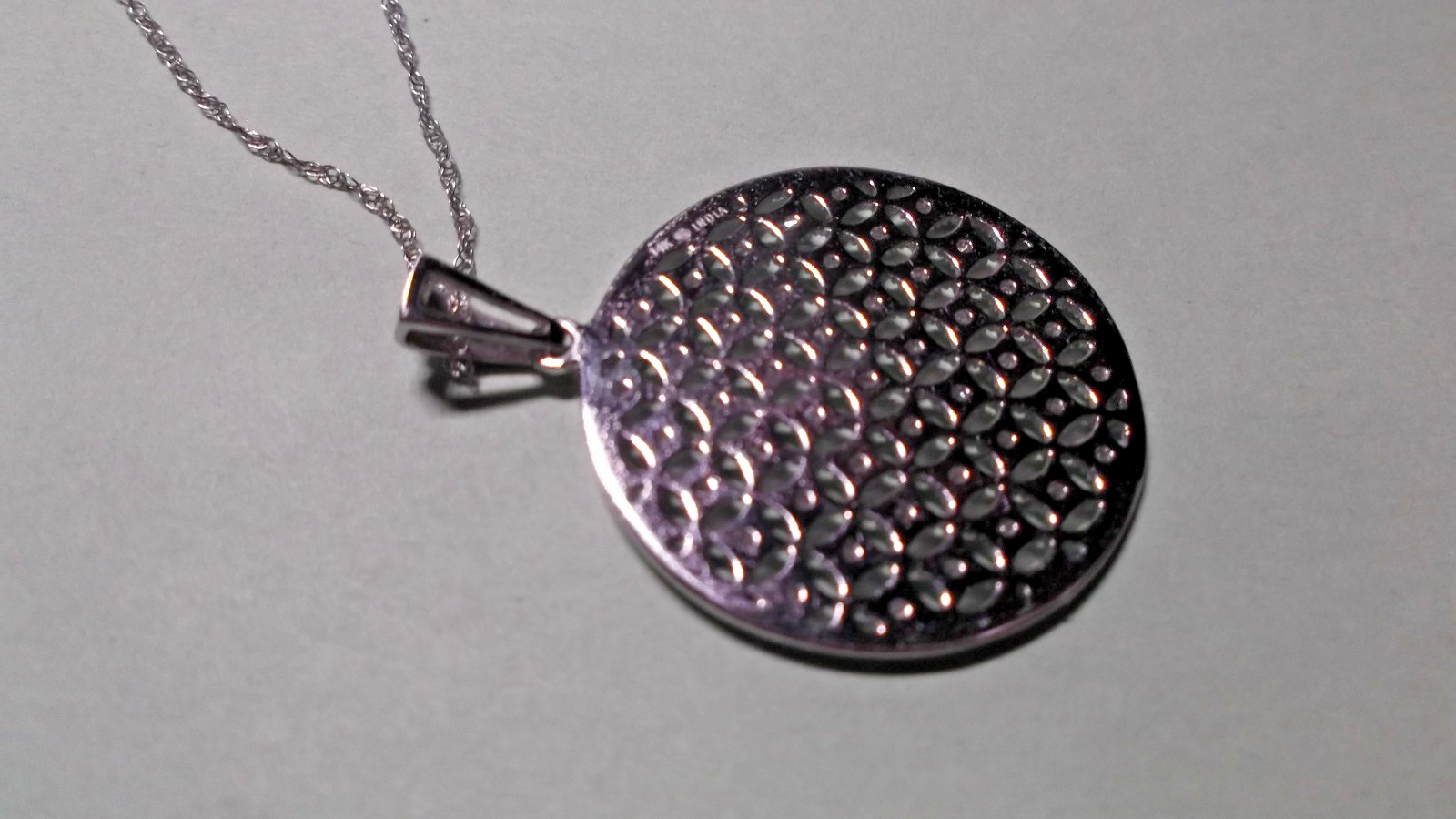 14K White Gold Round Diamond Disc Pendant Necklace 4.40 Grams in Lighted Display