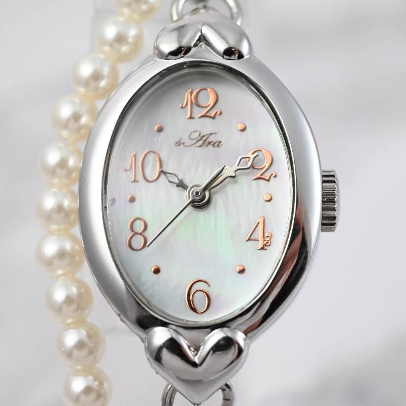 sara ladies’ wristwatch pearl bracelet watch oval shell dial heart motif silver