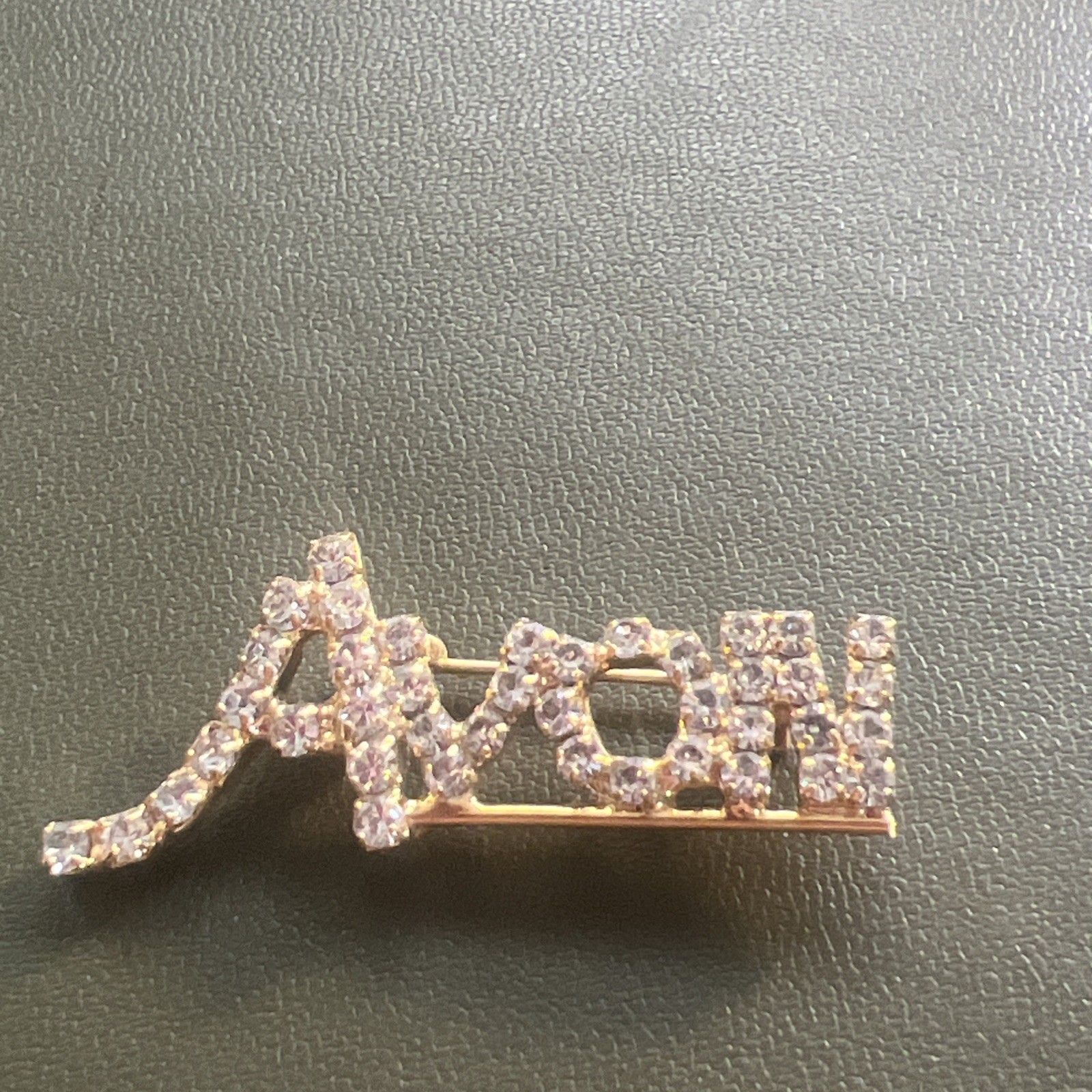 Beautiful Avon Goldtone Logo Pin (letters in Cursive) Approx. 1.5″ X .5″