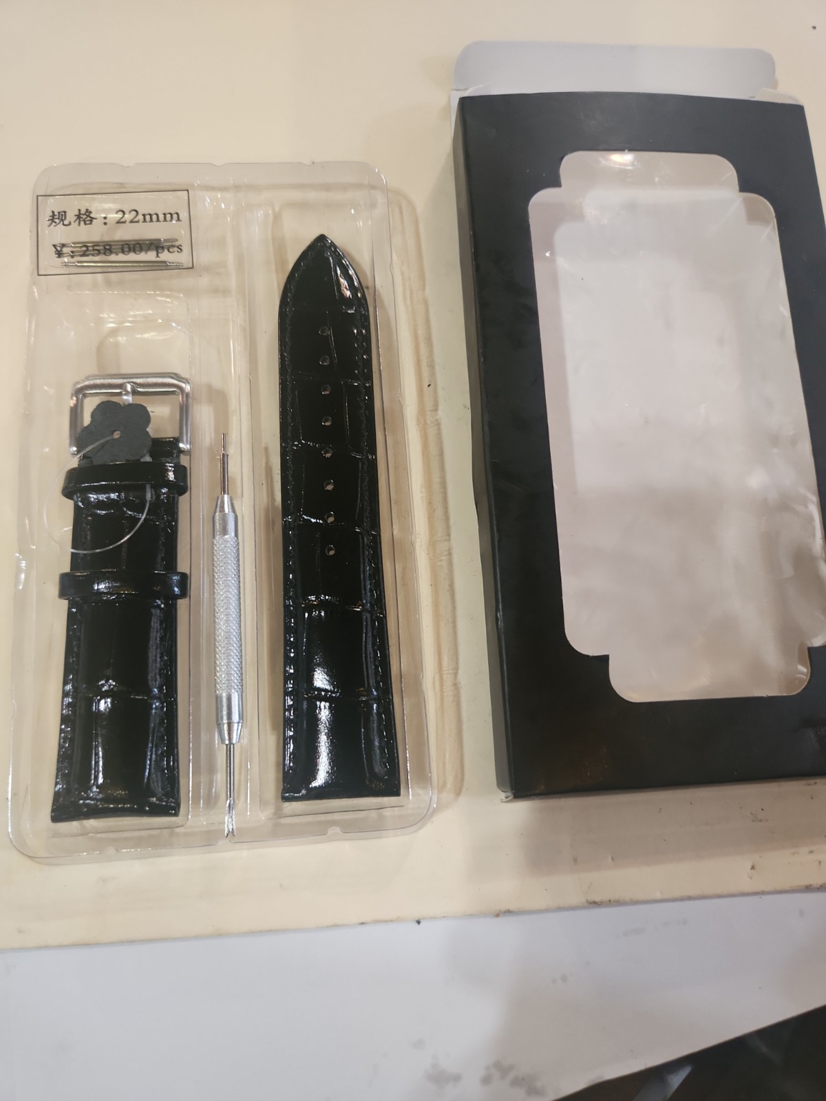 22mm black leather watch strap replacement kit that includes a spring