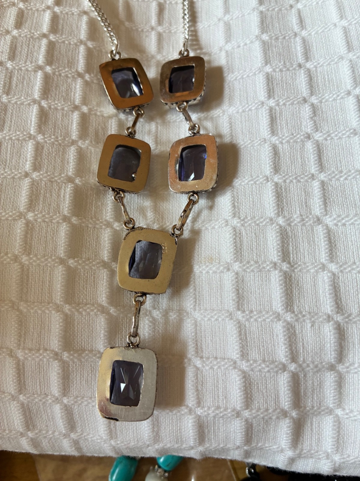 Dramatic large purple glass stones set in silver neckla