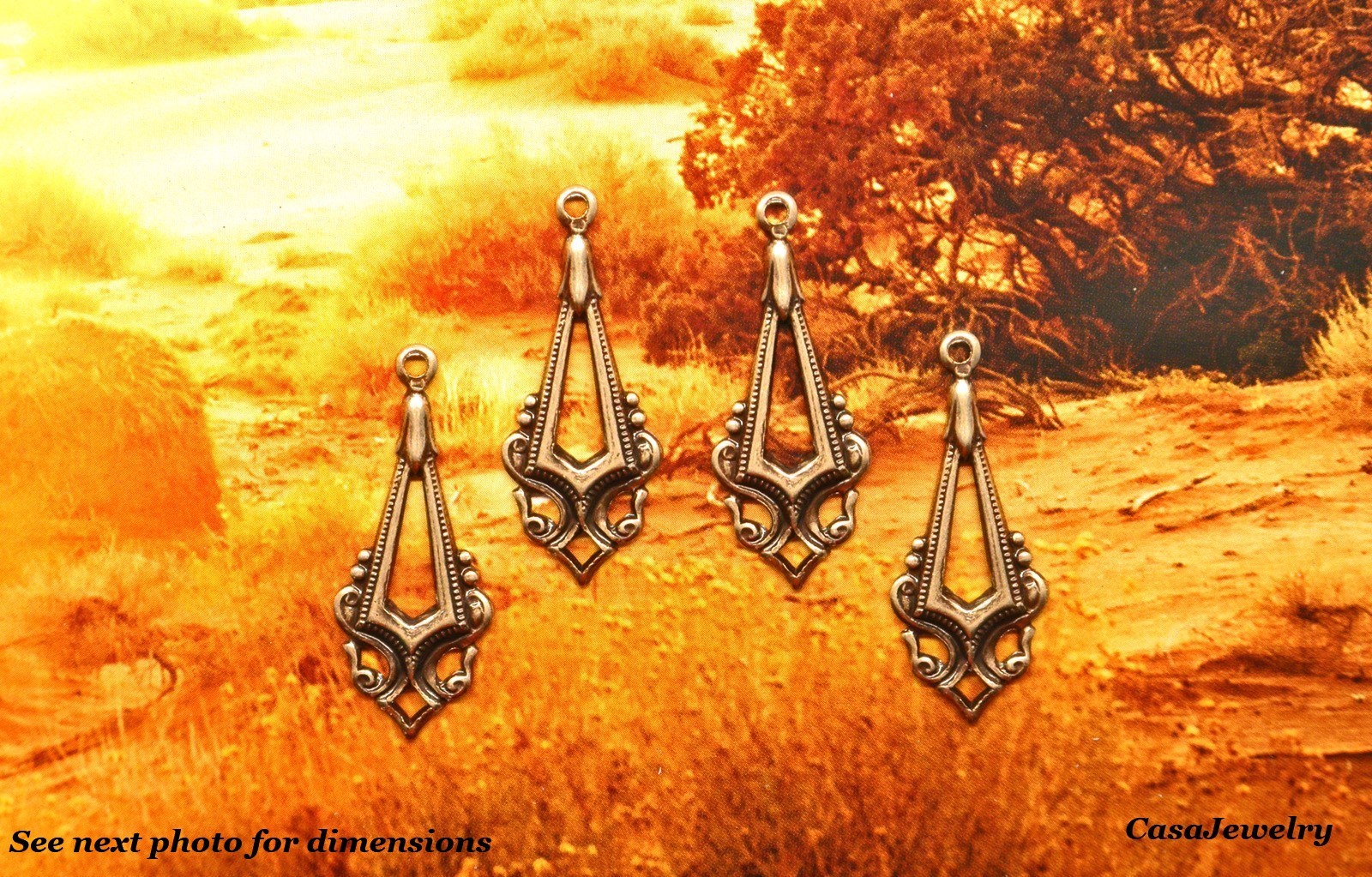 #0503 ANTIQUED GOLD OPEN CENTER TEARDROP W/TOP HANG RING – 4 Pcs