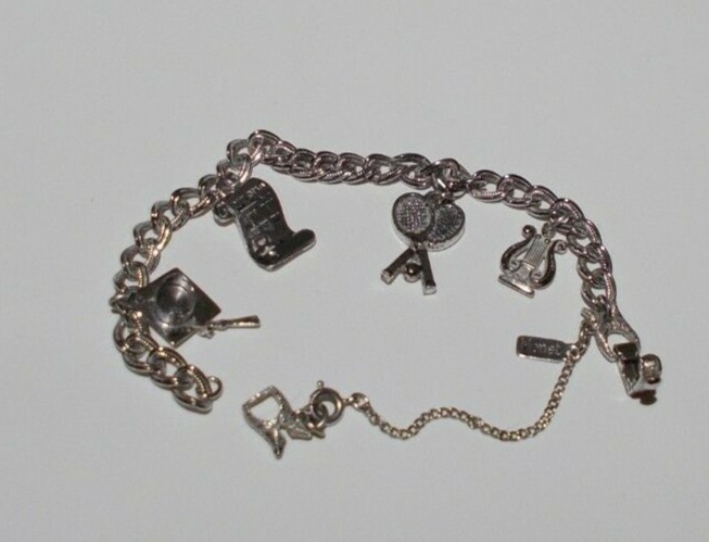 VTG MONET Bracelet with 4 Charms Size 7in Silver Ton Safety Chain 