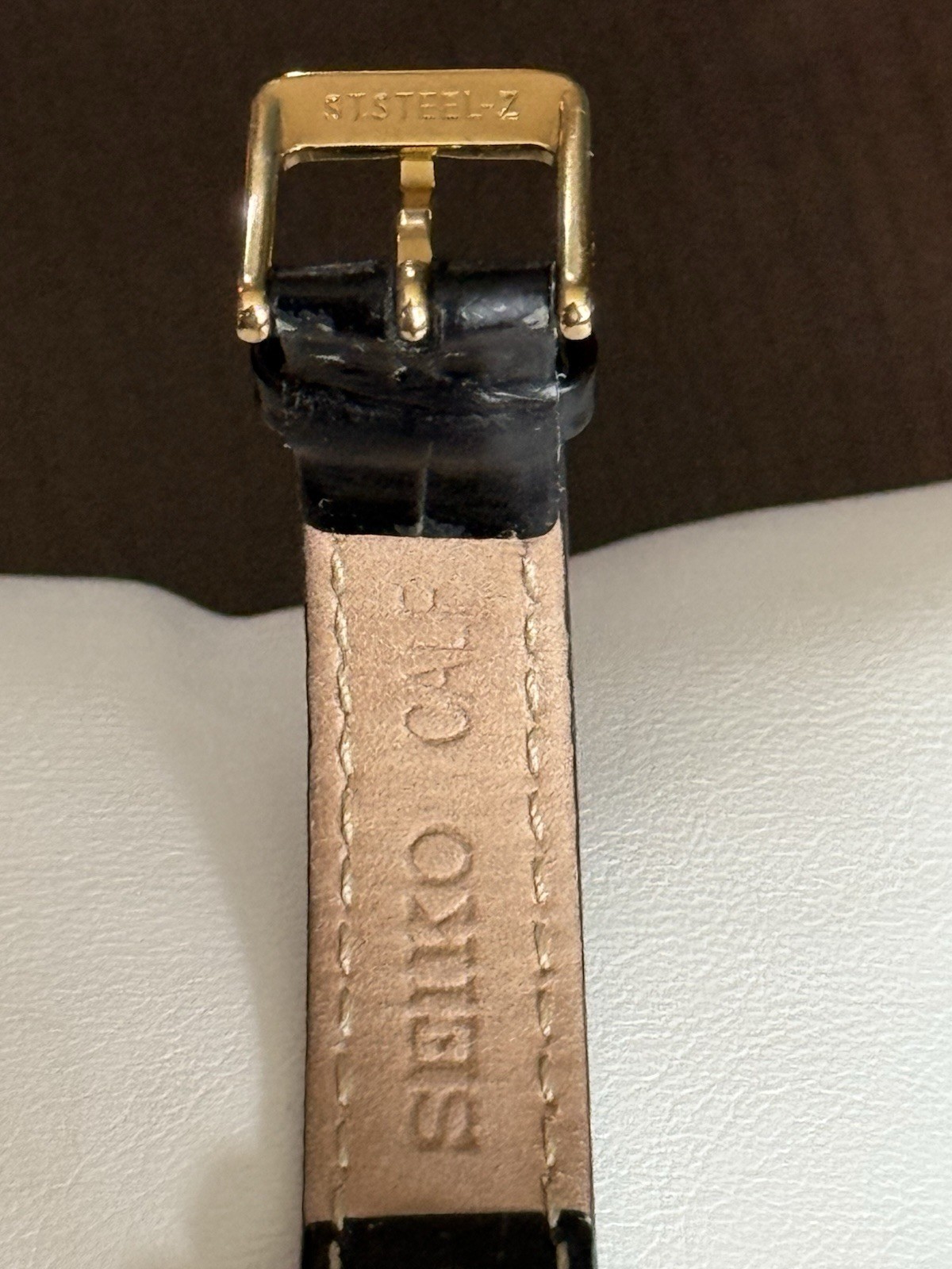 Vintage Seiko Women’s Quartz Tank Gold Tone White Roman Dial Black Leather Strap
