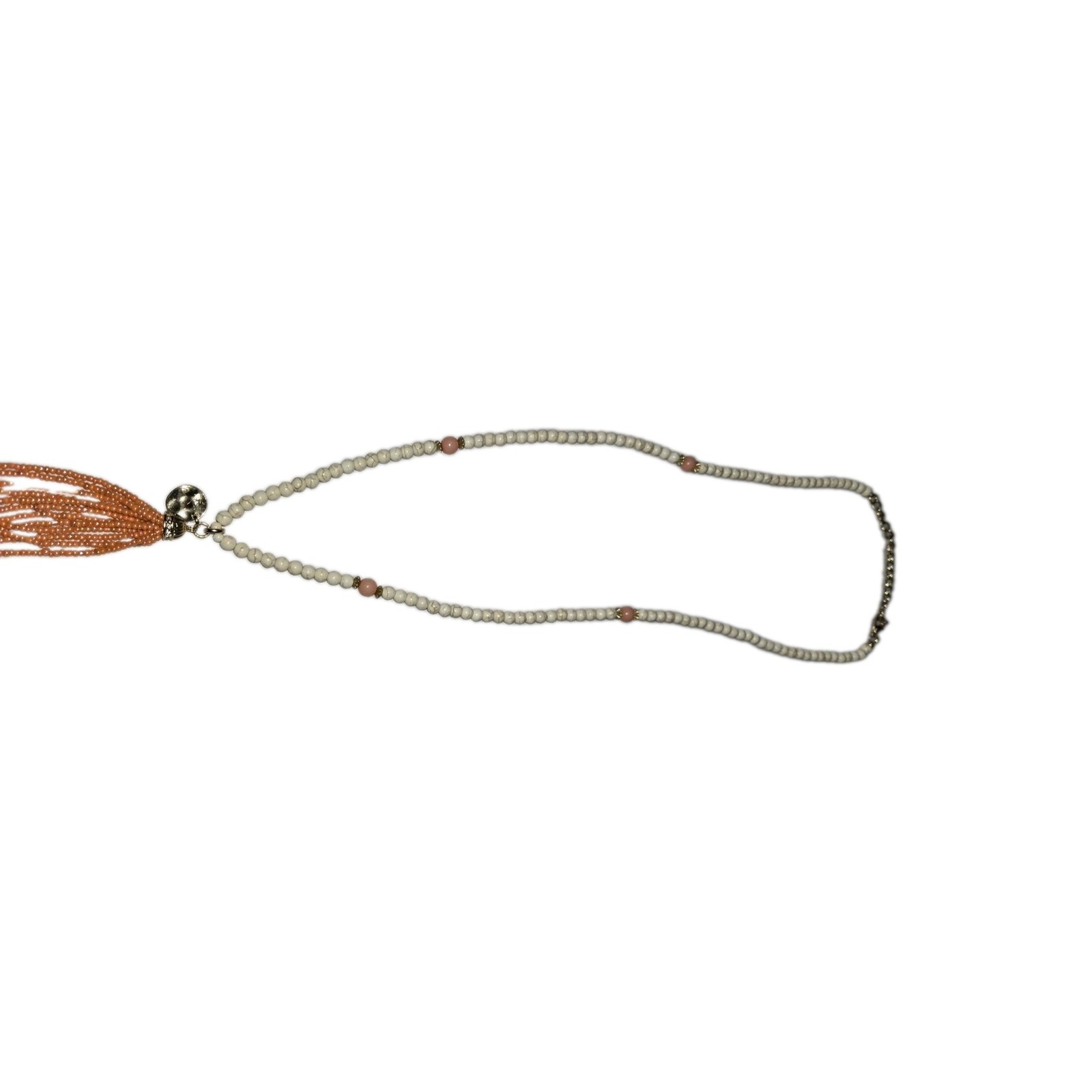 This cream and gold bead necklace features a long orange seed-bead tassel