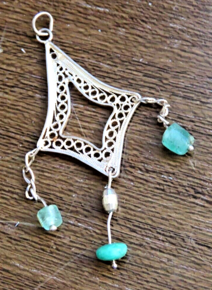 Handmade filigree silver pendant with Colombian emeralds