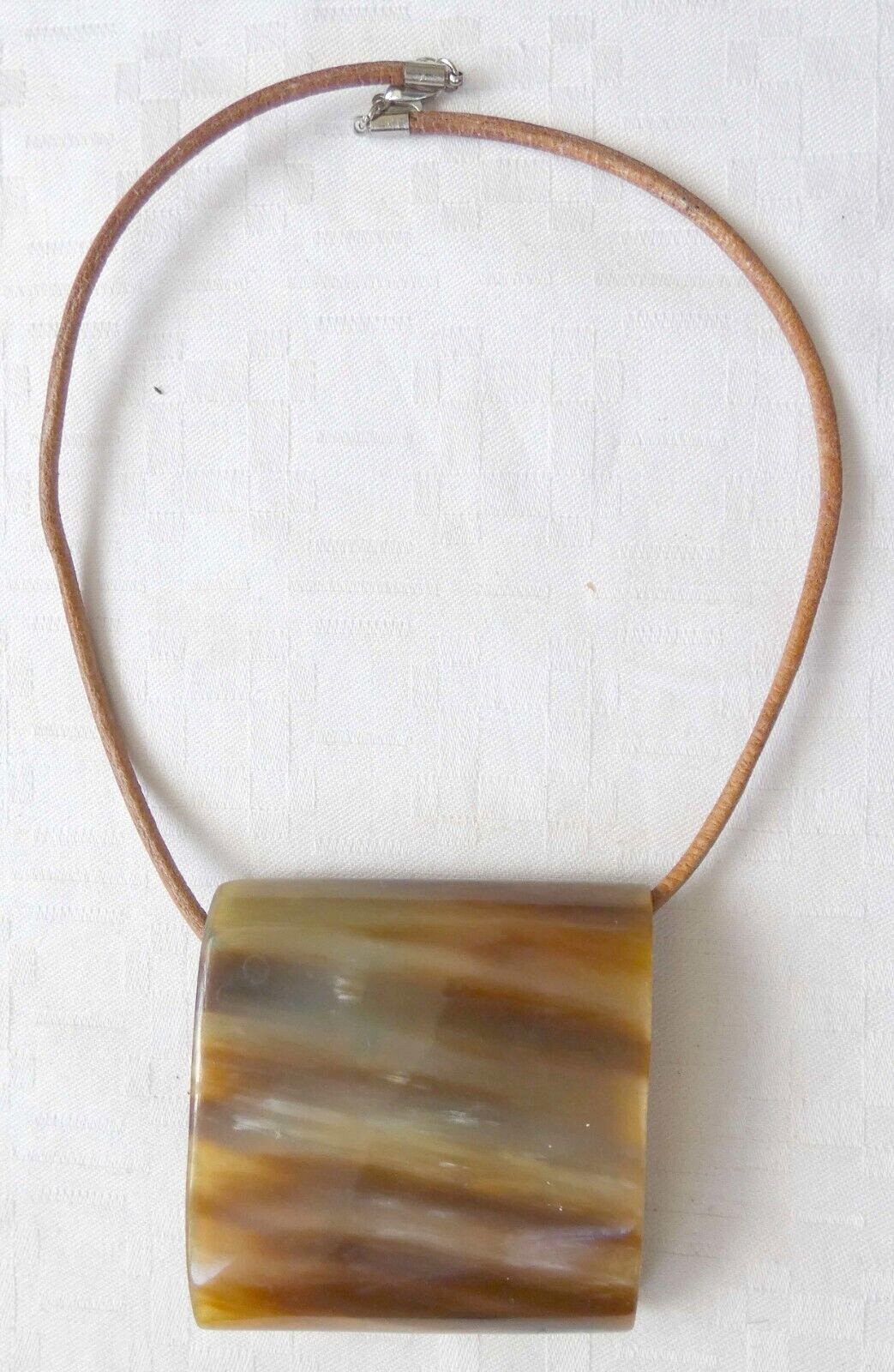 Antique horn necklace with leather cord. Size of pendant: 6.8 x 6.6 cm.