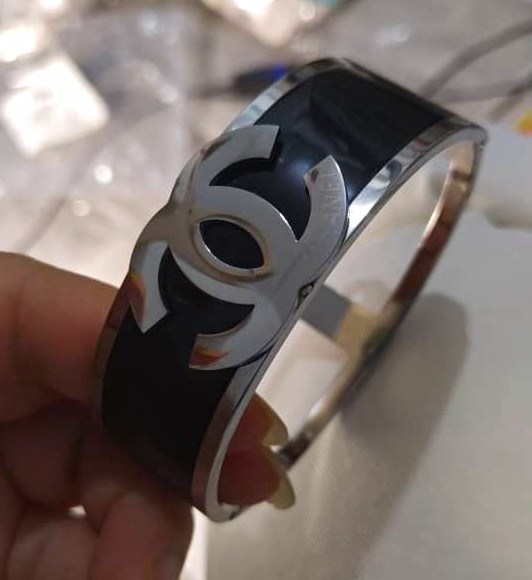 Black Bangle Bracelet with Silver-Tone Logo Design, No Stone