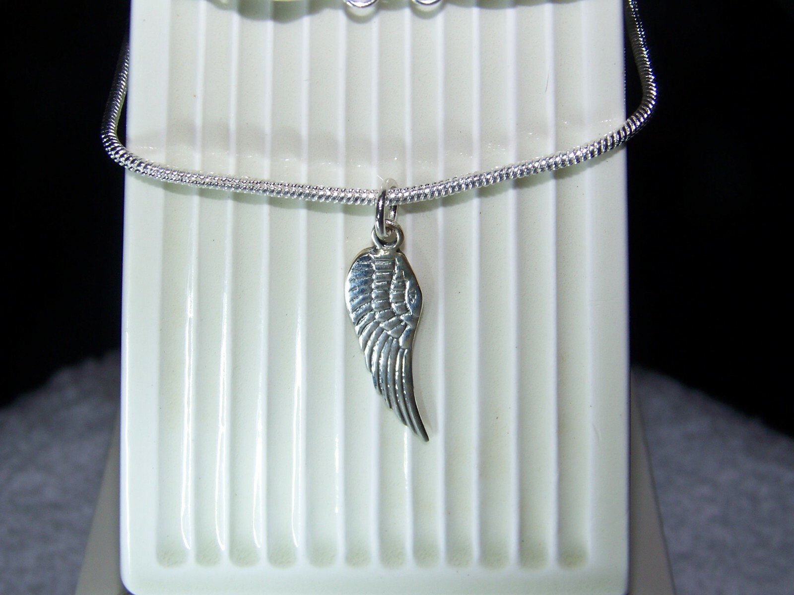 Sterling Silver Angel wing pendent and 2mm 16-30 inch sterling necklace.