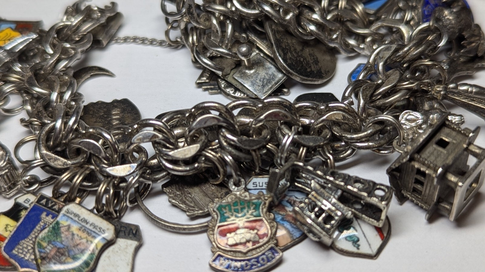 VINTAGE STERLING SILVER CHARM BRACELET WITH ABOUT 35 CHARMS WEIGHS 94.4 GRAMS
