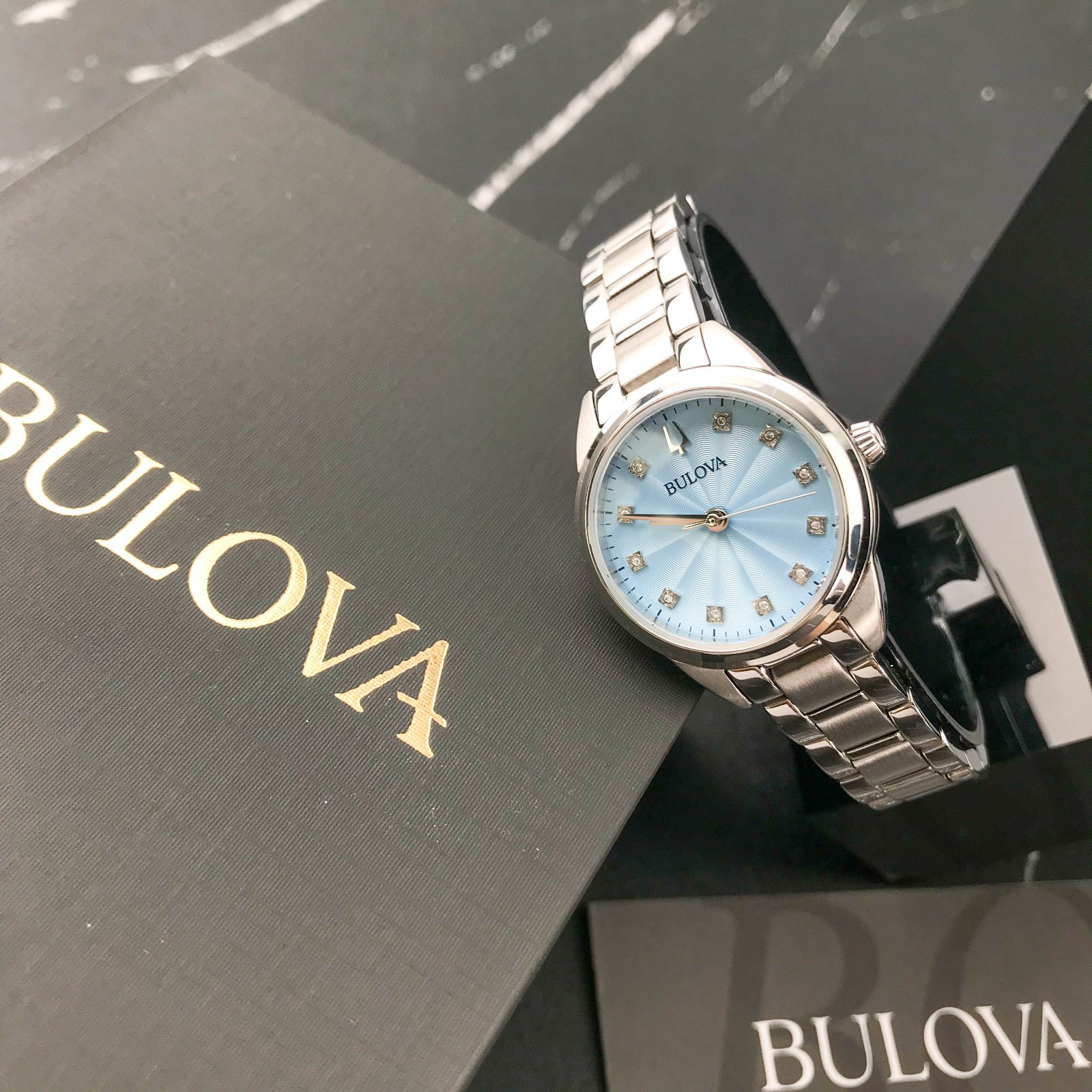 Bulova Classic Sutton 96P250 Blue Dial 28MM Quartz Ladies Watch with 11 Diamonds