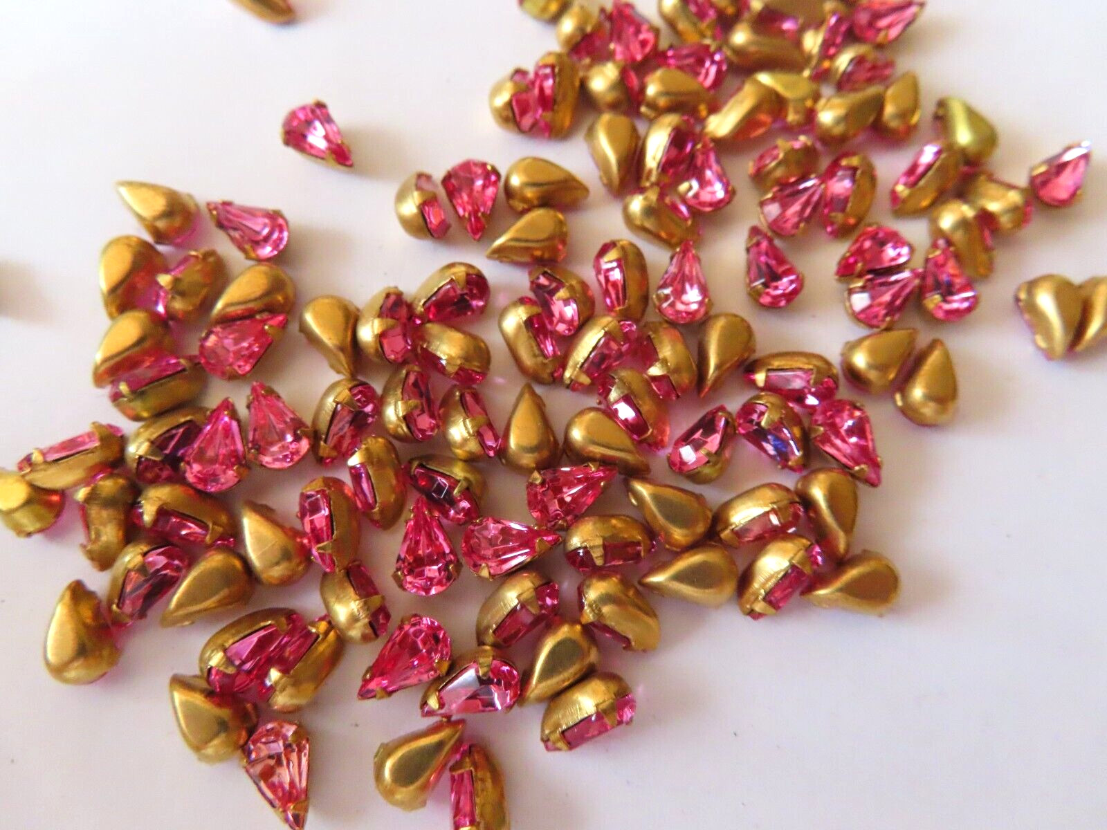 72 Swarovski Pearshape Rhinestones 8×4.8mm Rose/Brass settings.