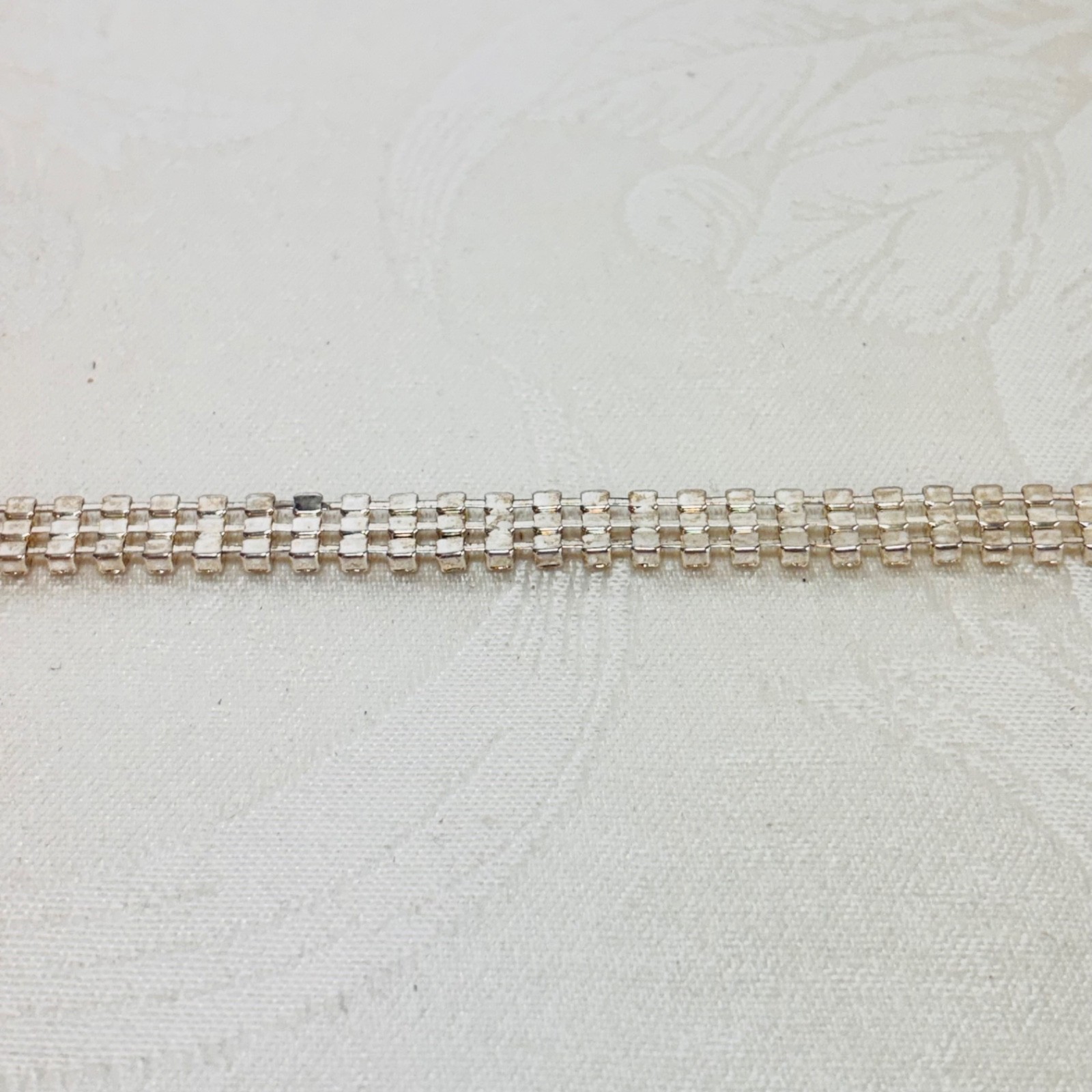 BRACELET vintage rhinestone triple row silvertone metal fold over clasp 7 1/2″ c
