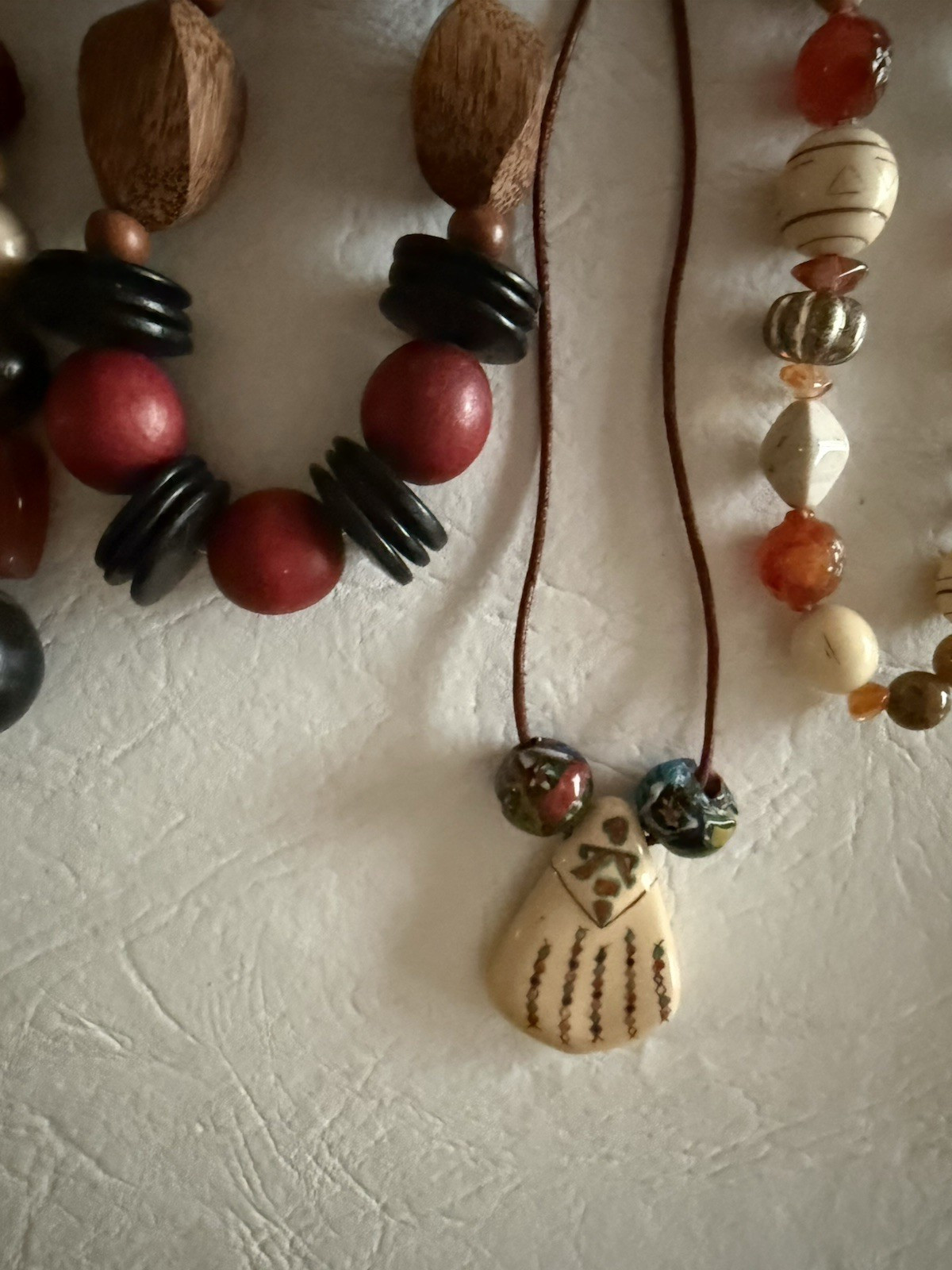 Lot of 10 necklaces, mostly wood beads, some Lucite, ethnic look earth tones