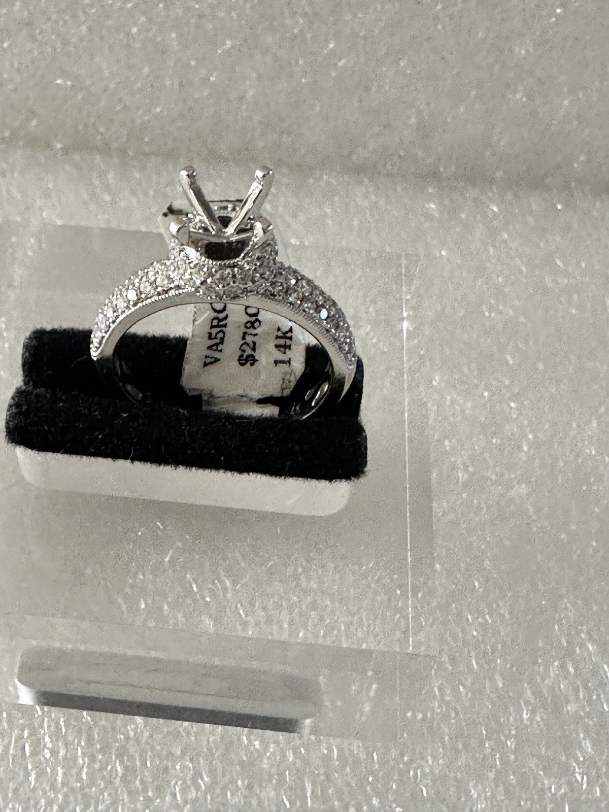 14kt,white gold semi mount ring with 0.62ct, VS2 clarity size 6, 4.40 grams.