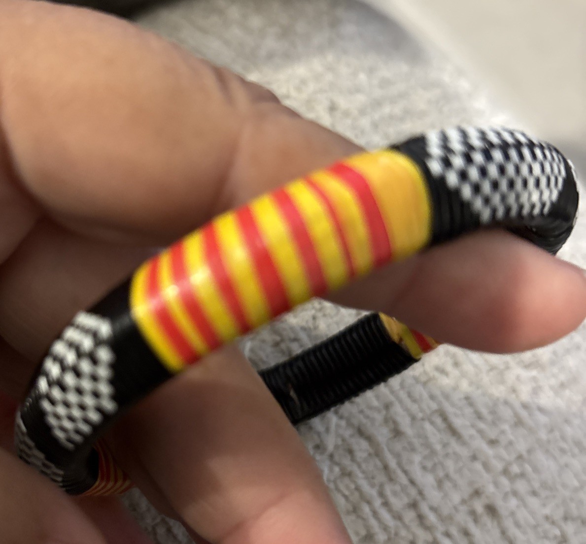 Woven Tuareg Bracelet Black Yellow Red & White 3″ in diameter