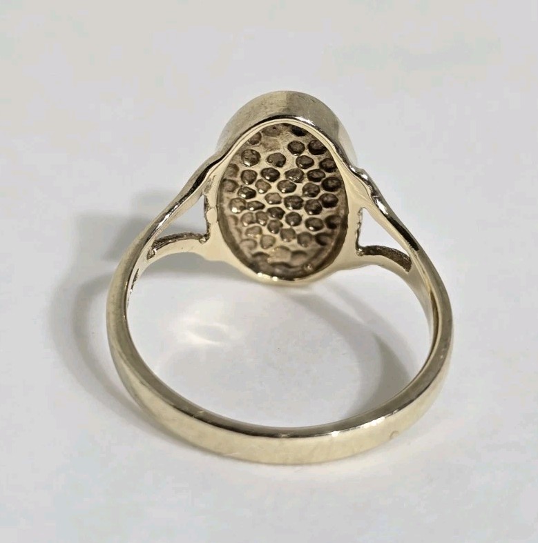 9ct Yellow gold open work ring. Collet set with an oval Blue John Cabochon.
