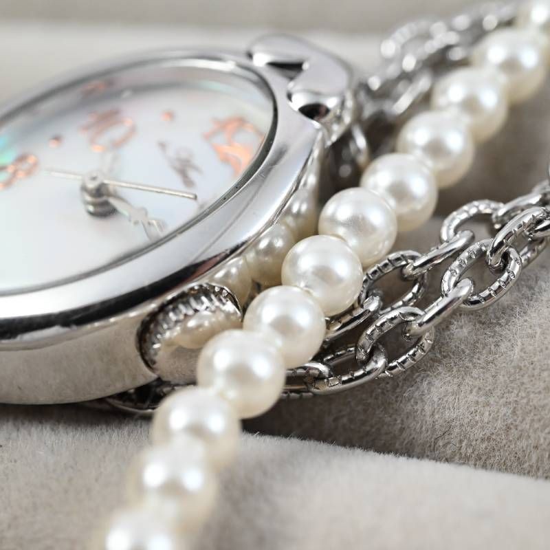 sara ladies’ wristwatch pearl bracelet watch oval shell dial heart motif silver