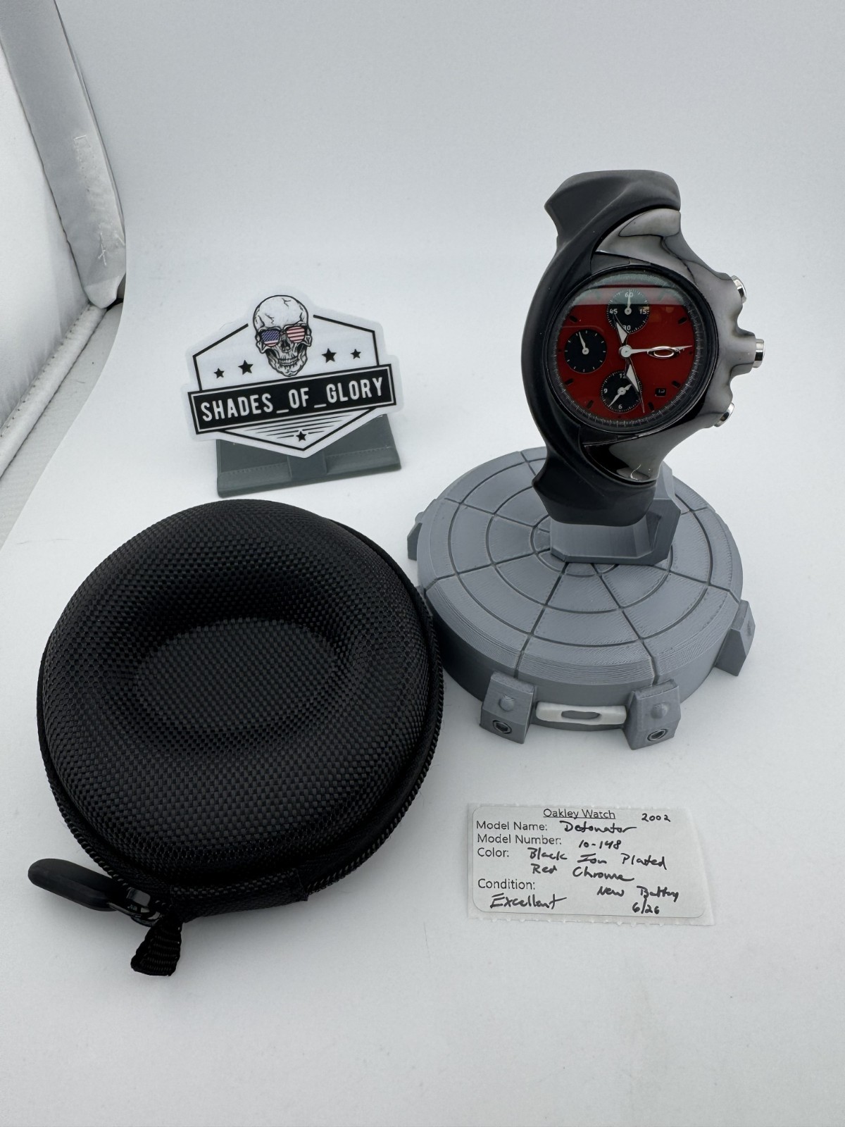 OAKLEY DETONATOR WATCH BLACK ION PLATED W/ RED CHROME DIAL RUBBER STRAP 10-148